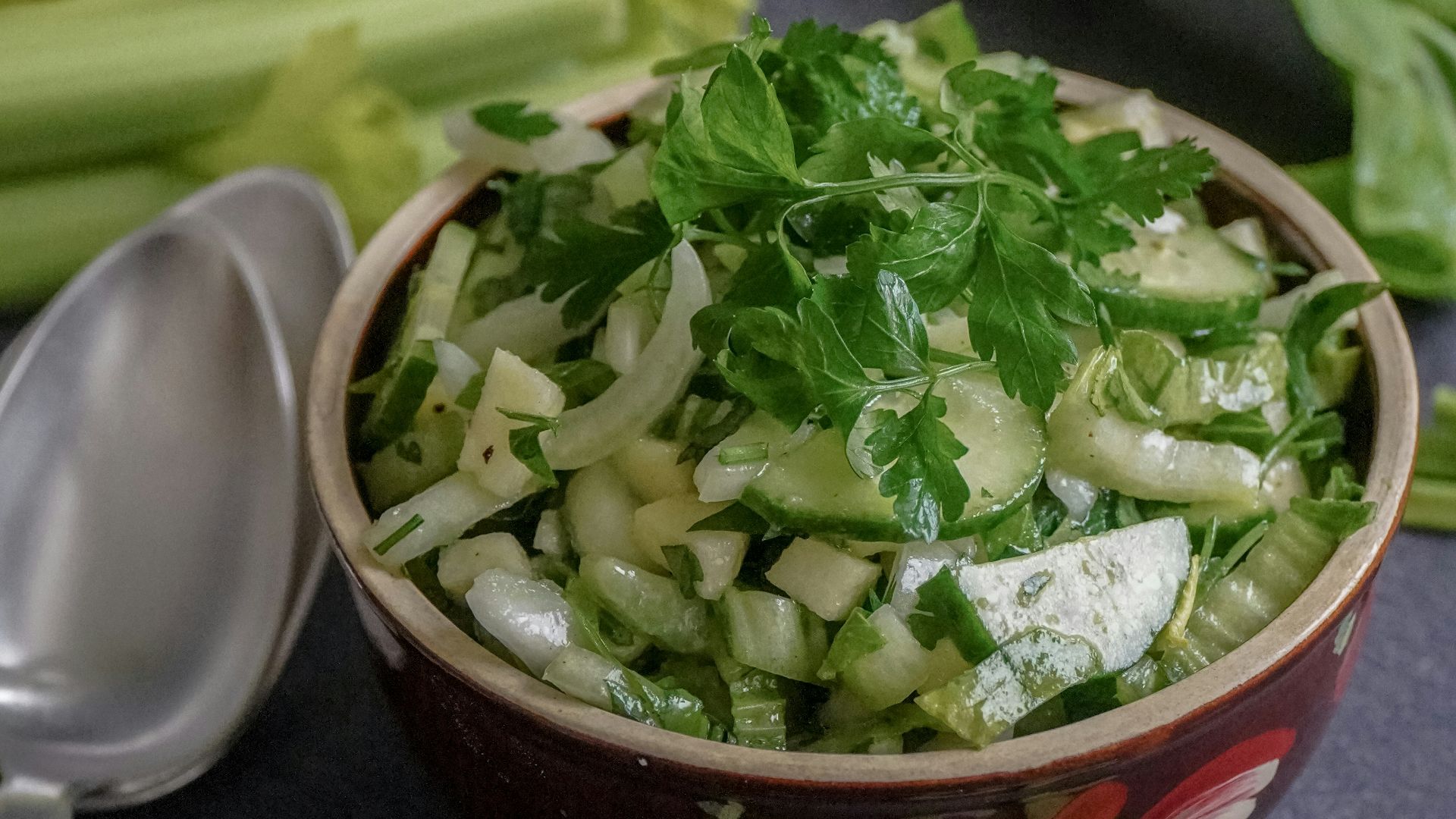 green vegetable on red ceramic bowl