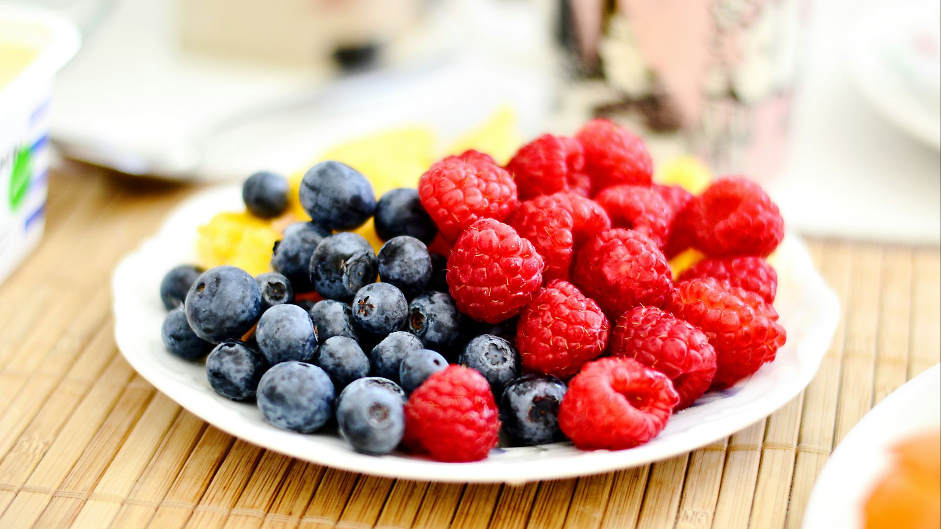 strawberries and blue berries on palte