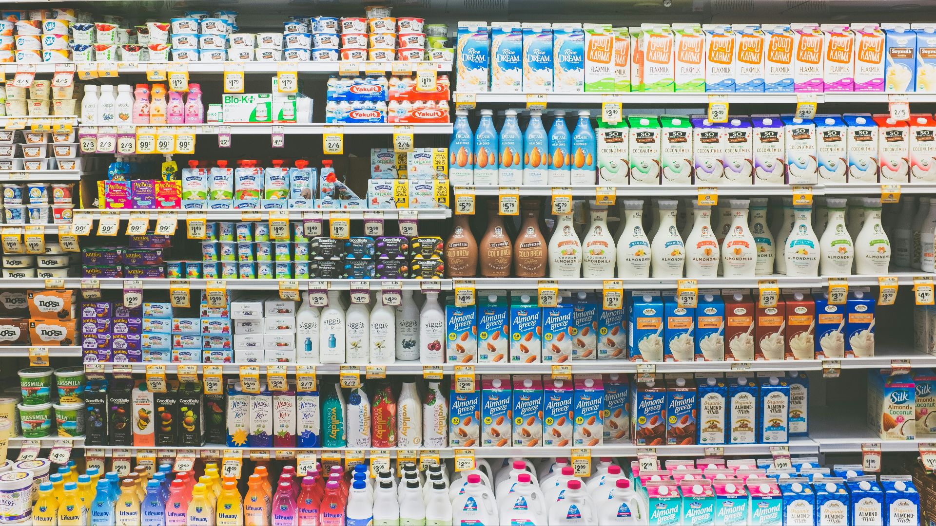 assorted drinks on white commercial refrigerator