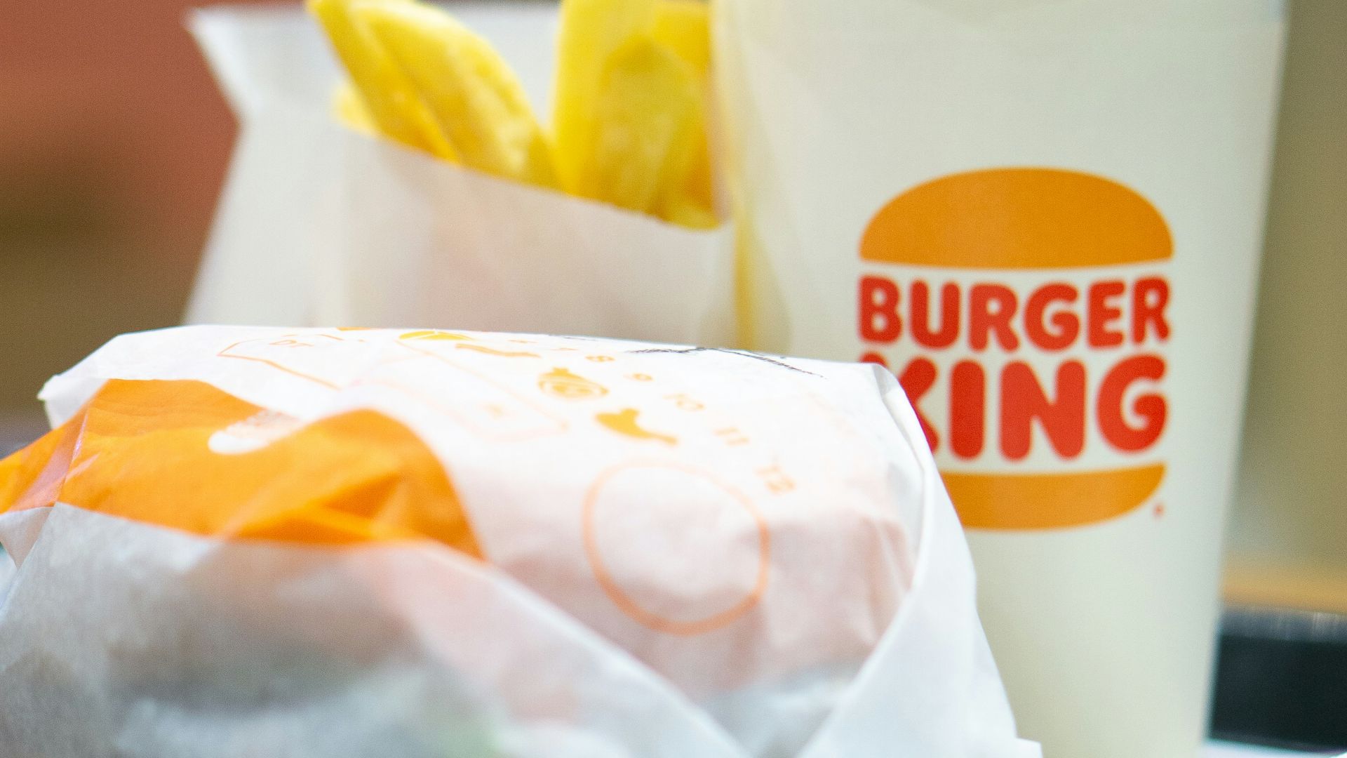 a plate with a sandwich and a cup of coffee