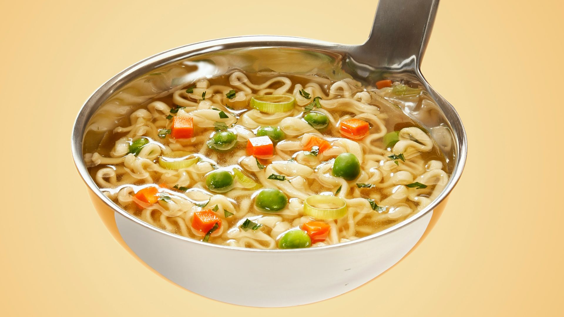 silver steel scoop with noodles