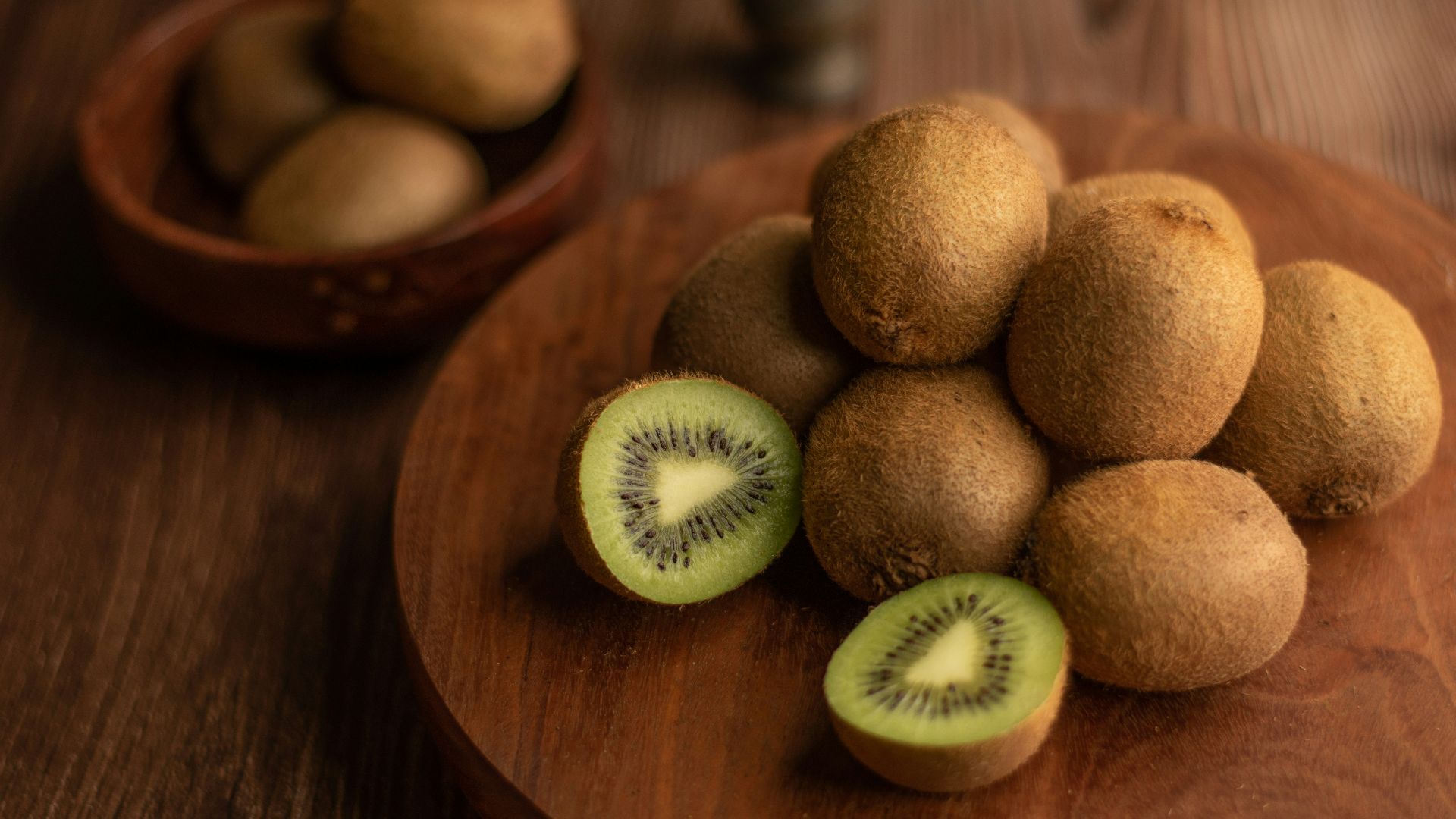 brown round fruit on brown wooden table