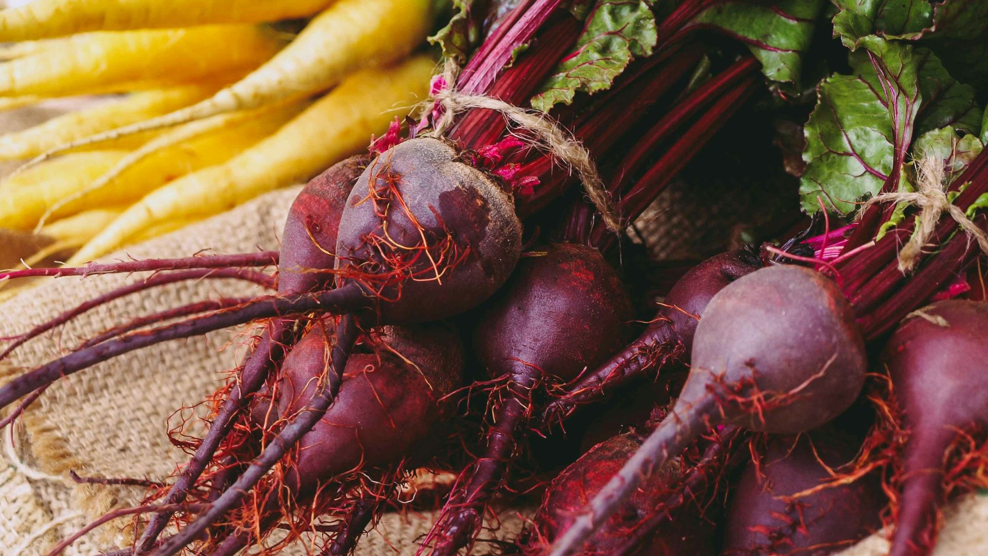 a table topped with lots of different types of vegetables