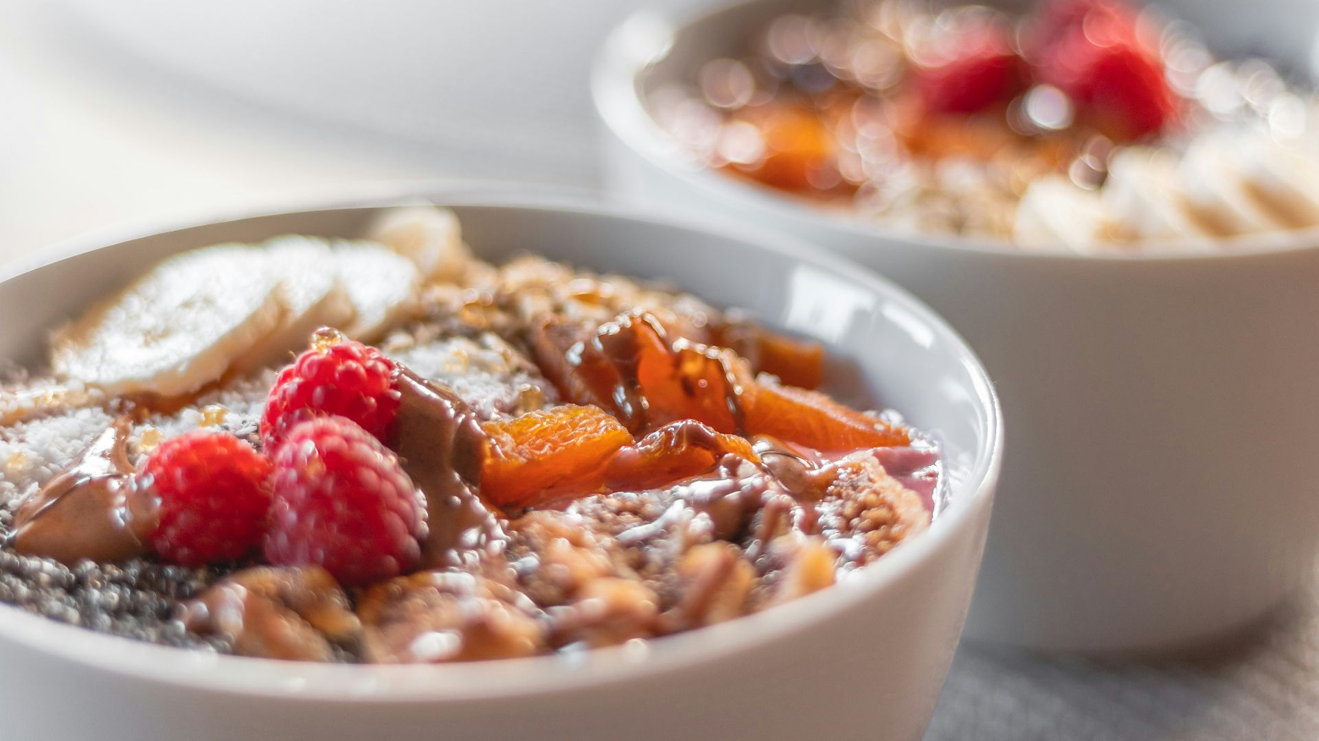 a bowl of oatmeal with fruit on top