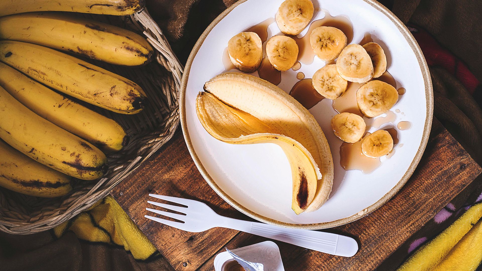 sliced ripe banana on round white ceramic plate