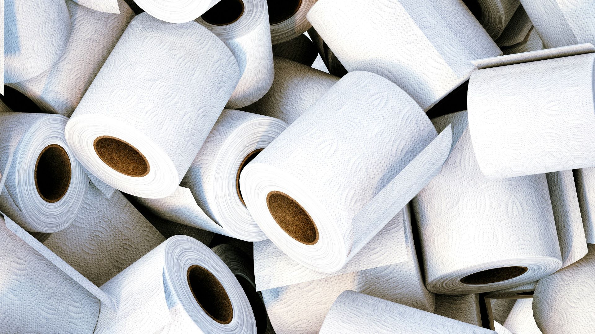 a pile of white toilet paper sitting next to each other