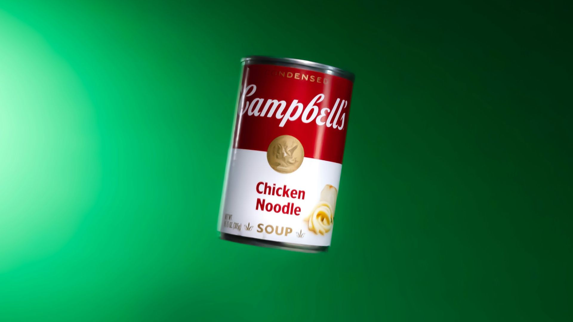 a can of rambulu chicken noodle soup on a green background
