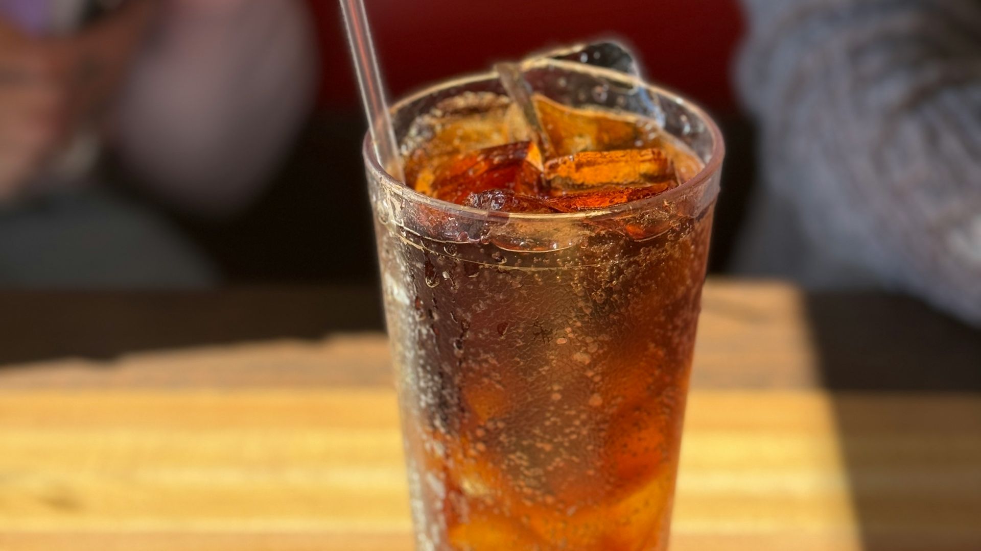 a drink sitting on top of a wooden table