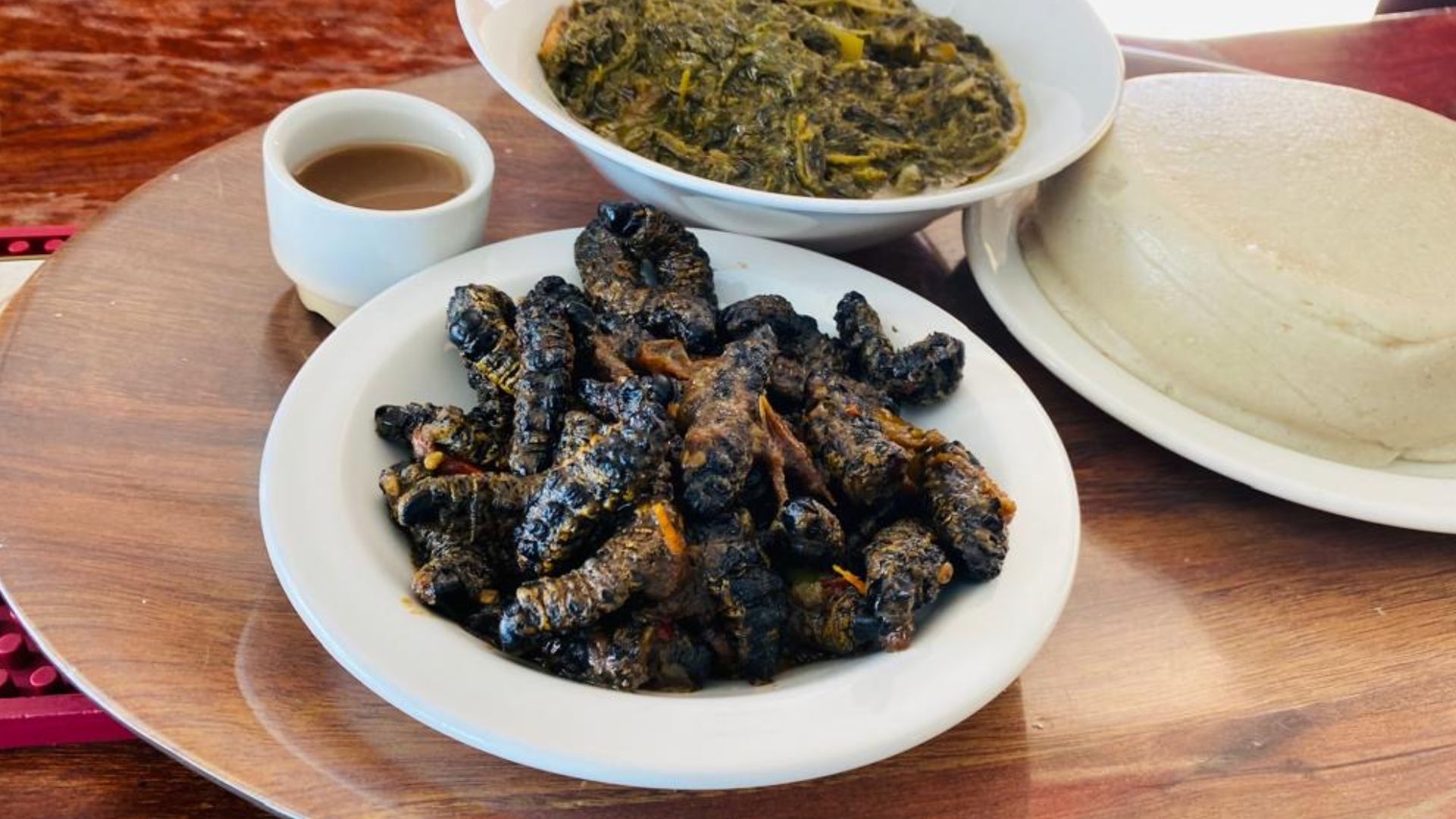 File:Mahangu Porridge served with mopane worms and spinach stew.jpg