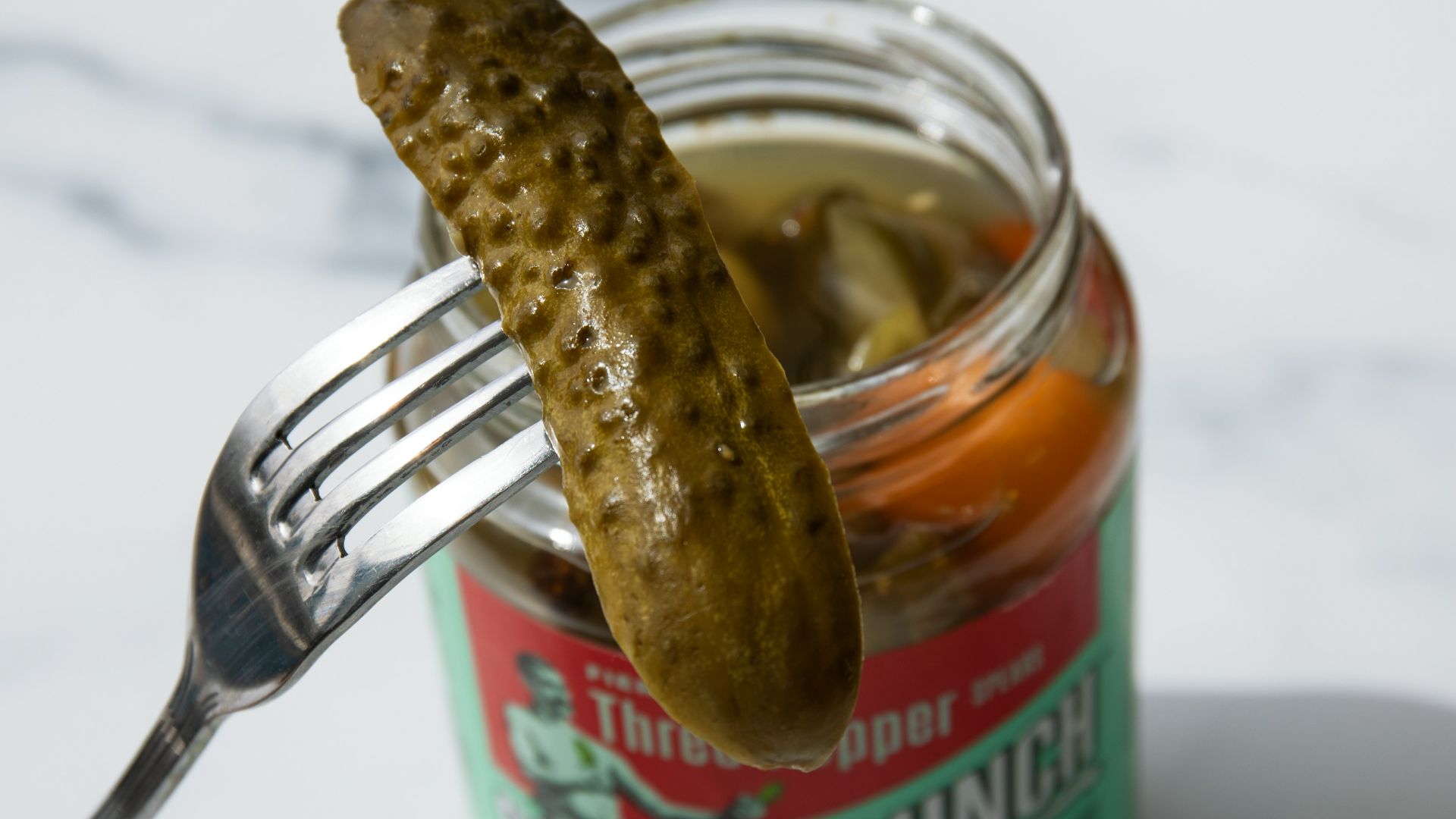 stainless steel fork on green labeled can