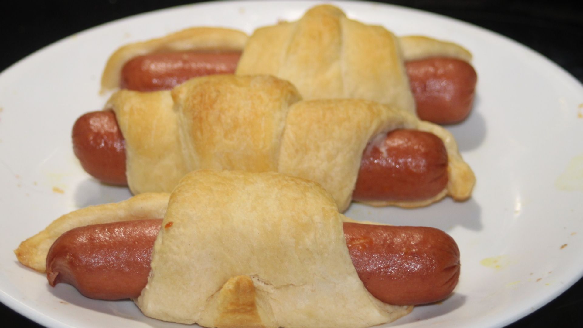 File:Three home made pigs in blankets on a white plate 01.JPG
