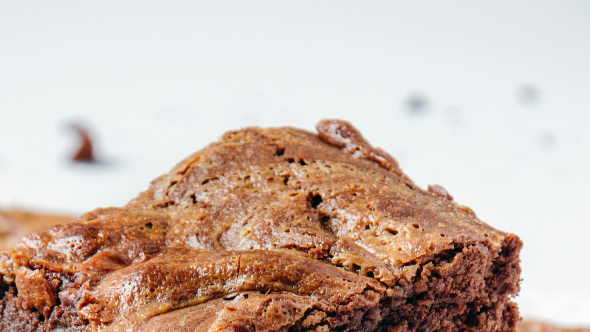 a pile of brownies sitting on top of a white plate