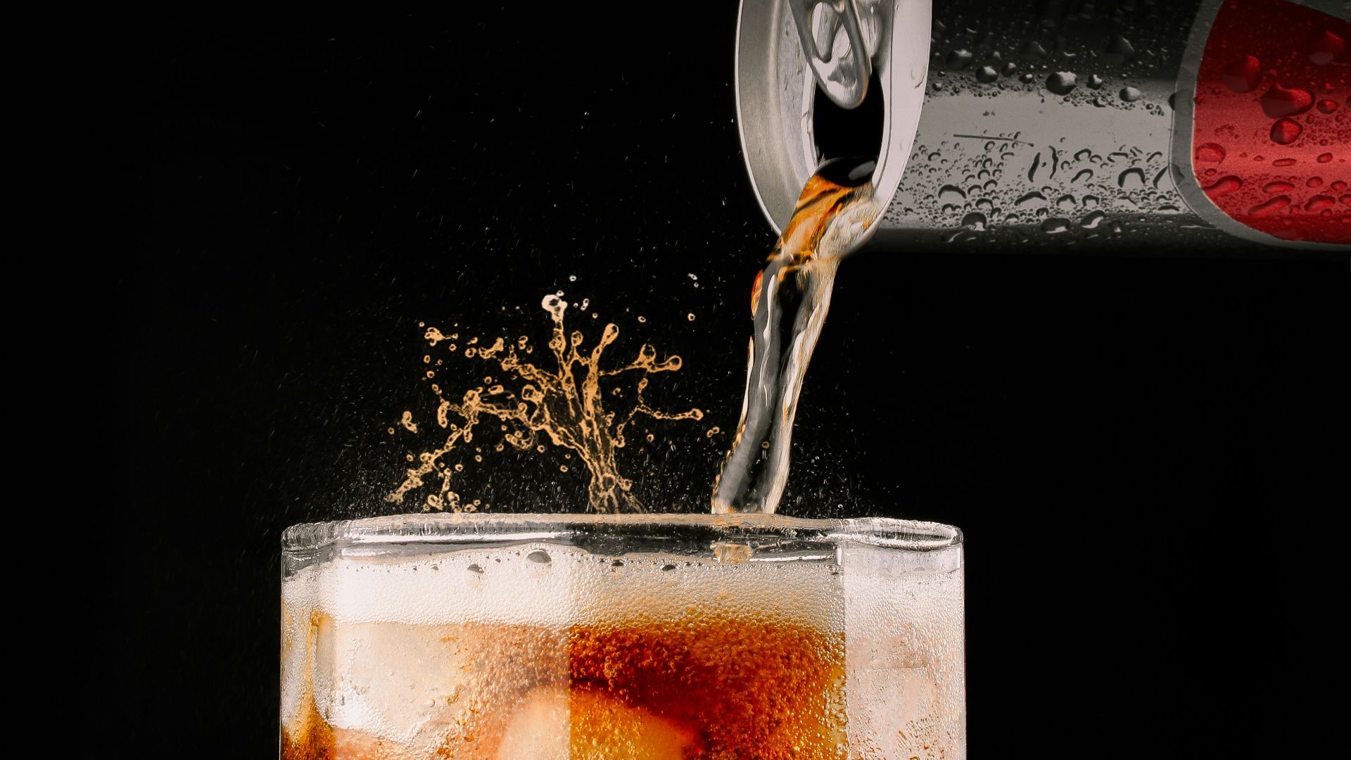 clear drinking glass with brown liquid