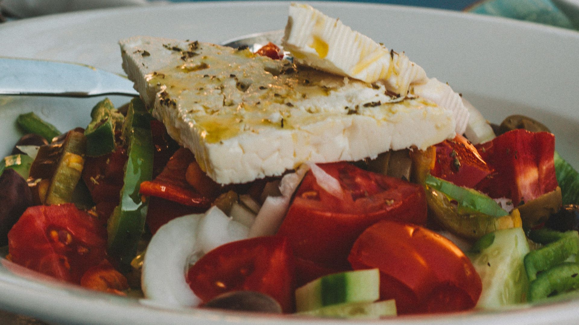 sliced tomato and cucumber on white ceramic plate