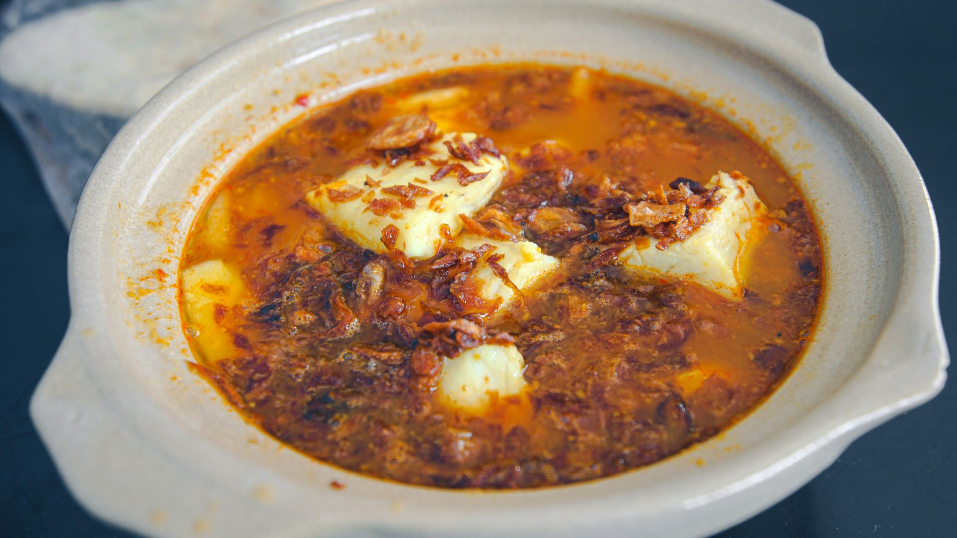 white ceramic bowl with brown soup