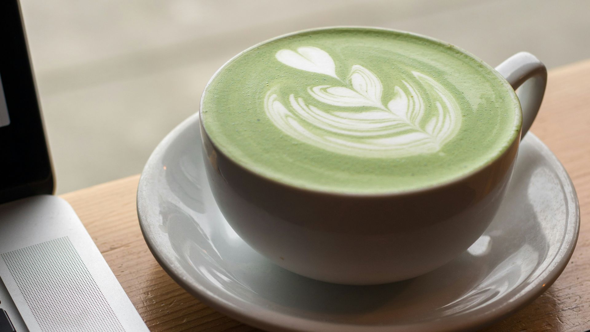 white ceramic teacup on top of white saucer