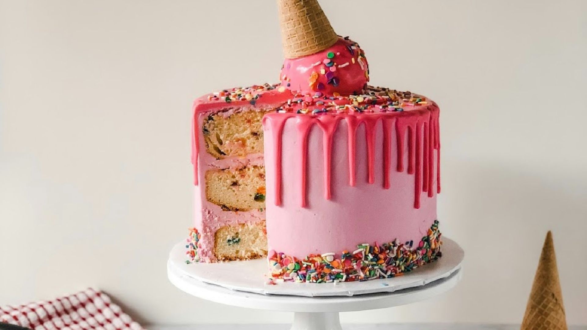 pink and white cake on white ceramic plate