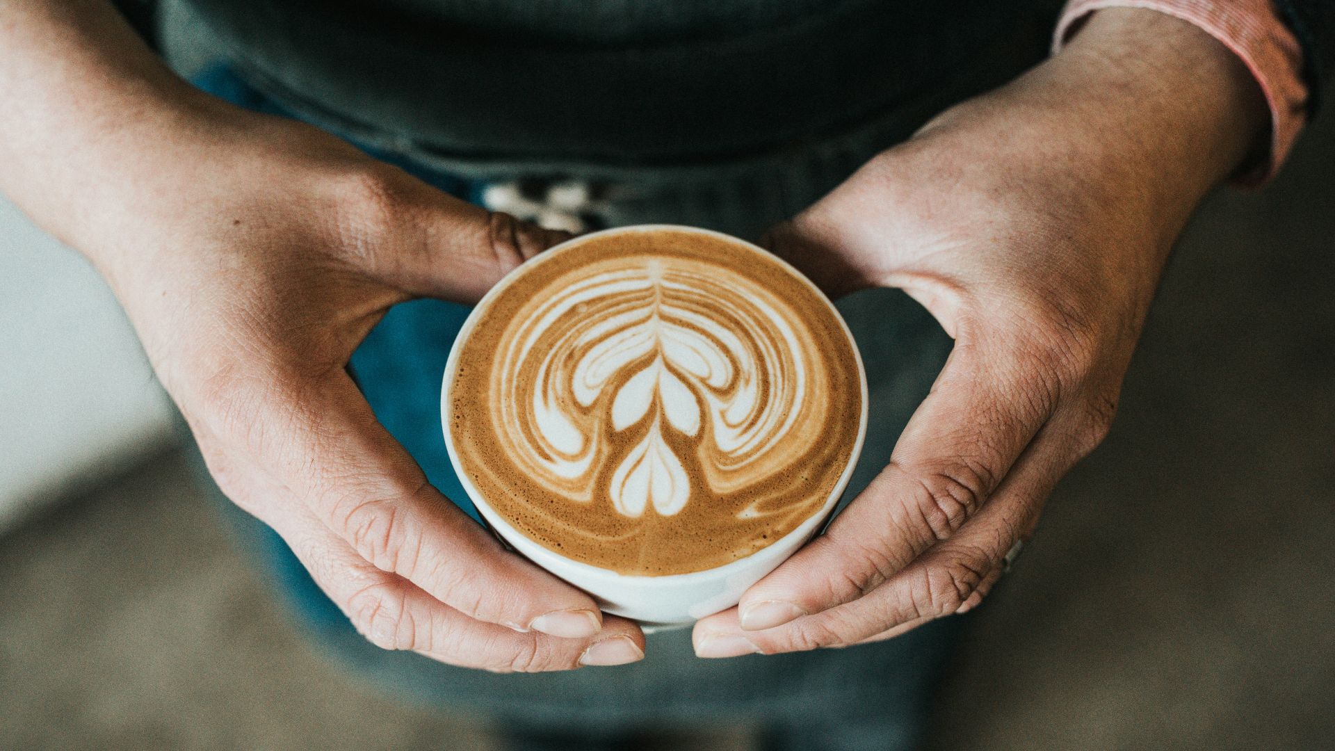focus photography of coffee artwork