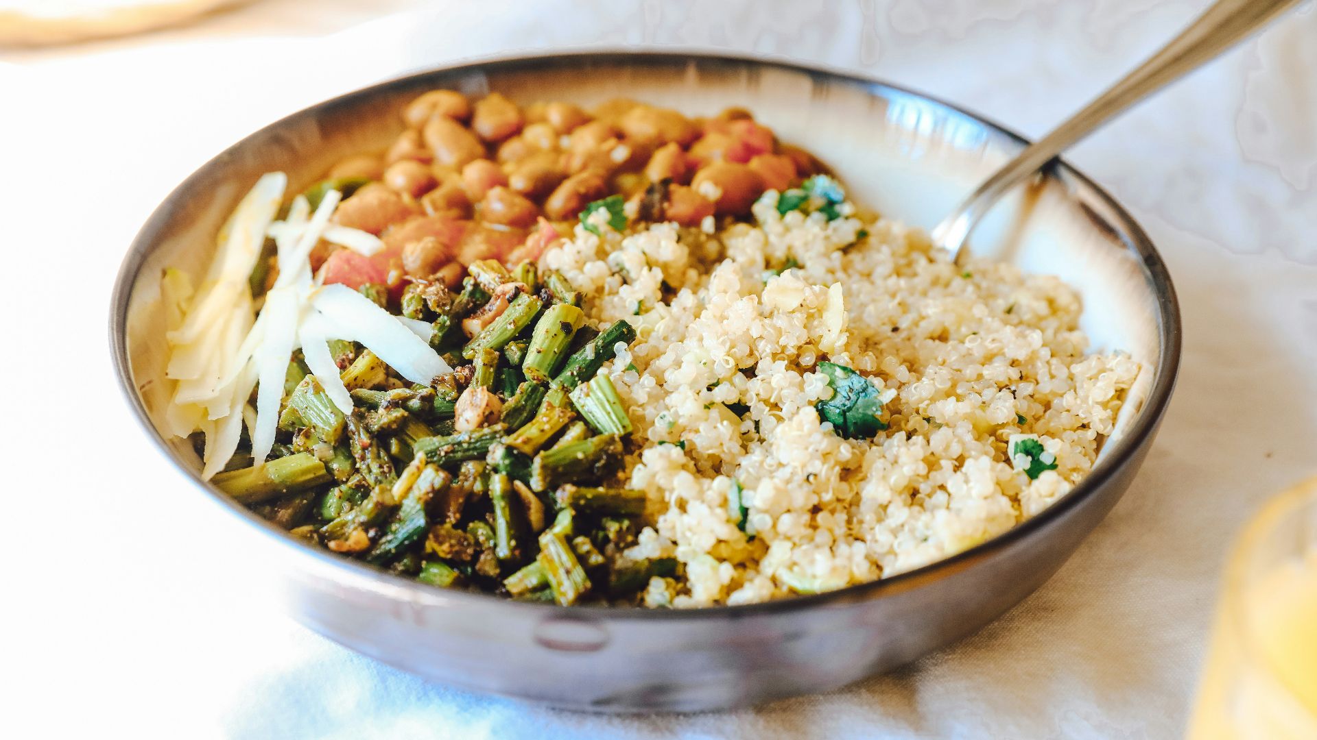 cooked rice with green peas and carrots on stainless steel bowl