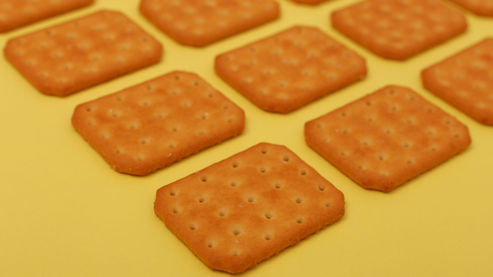 brown biscuits on yellow surface