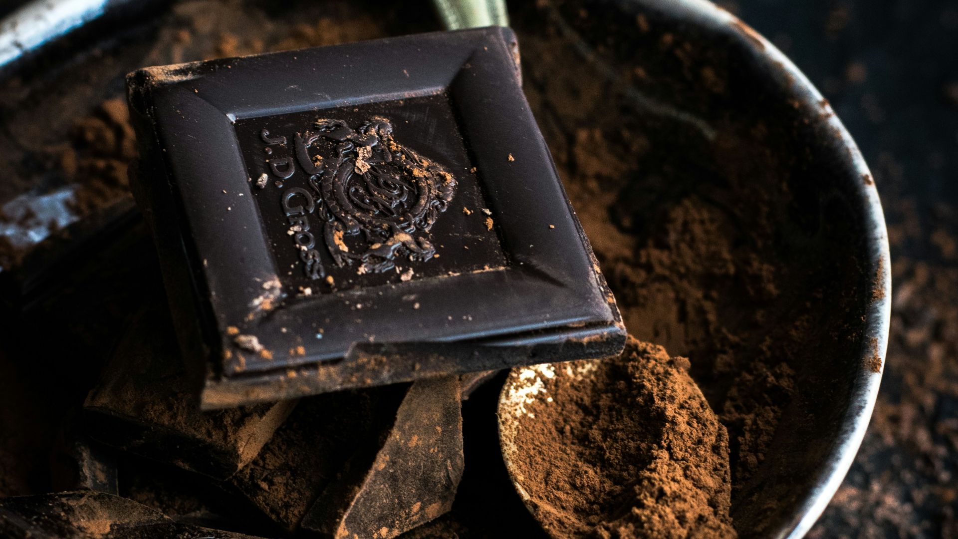 chocolate bar and powder in bowl