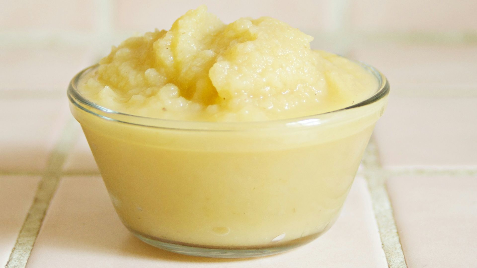 yellow cream in clear glass bowl