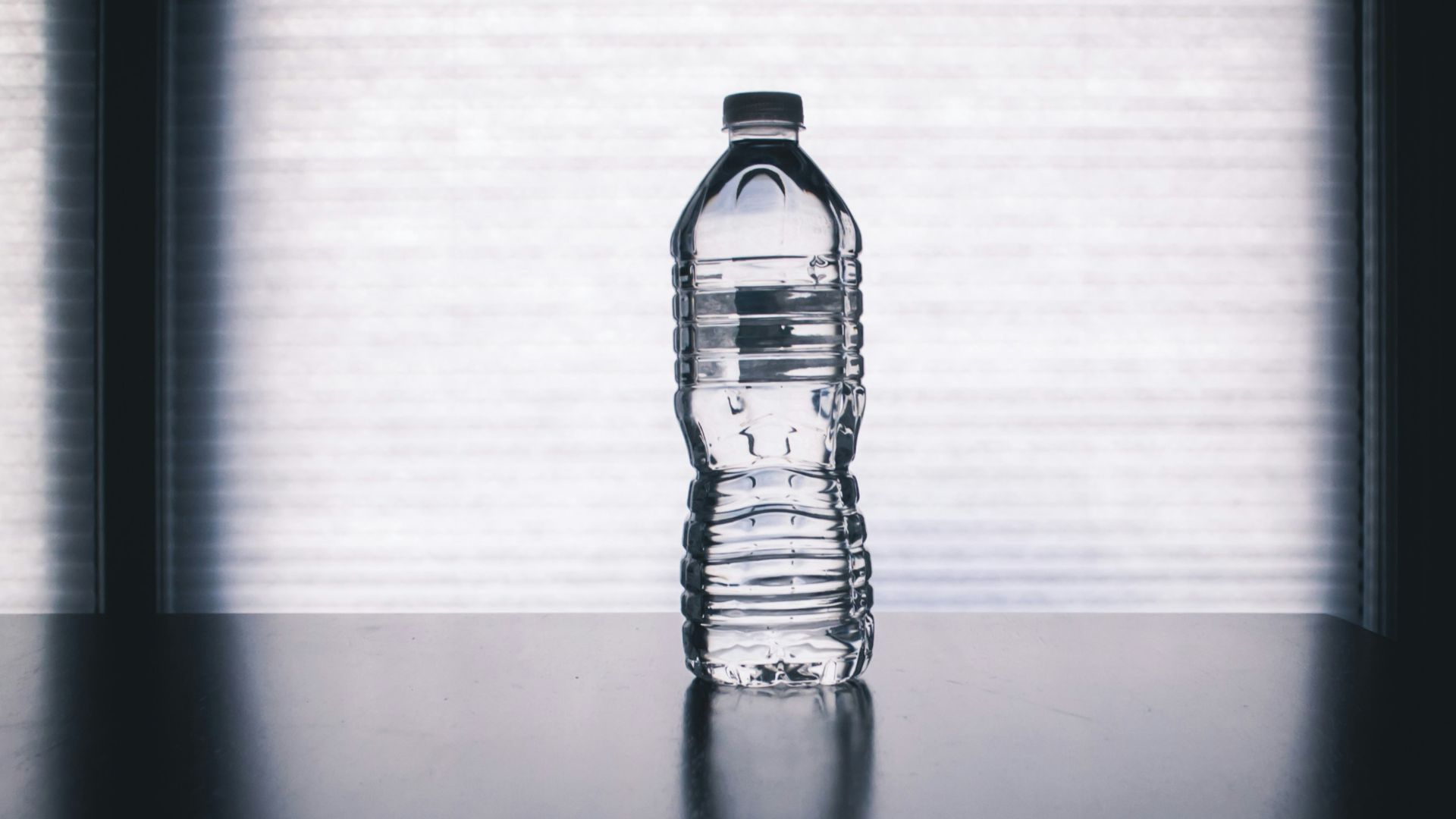 clear drinking bottle filled with water