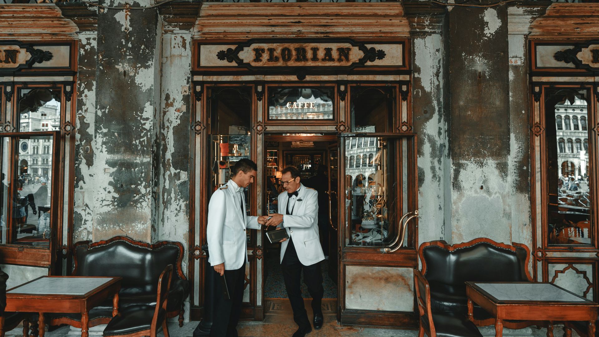 shallow focus photo of man in white suit jacket