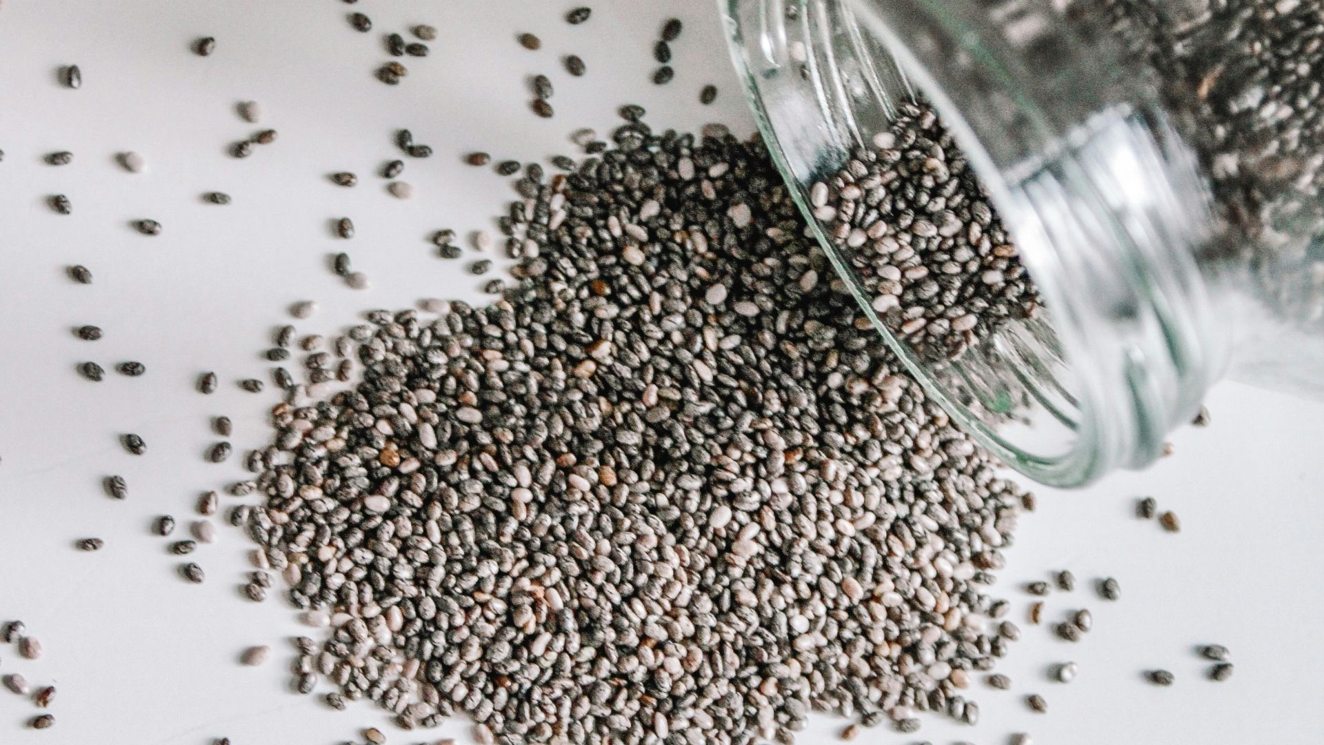 black beads in clear glass jar