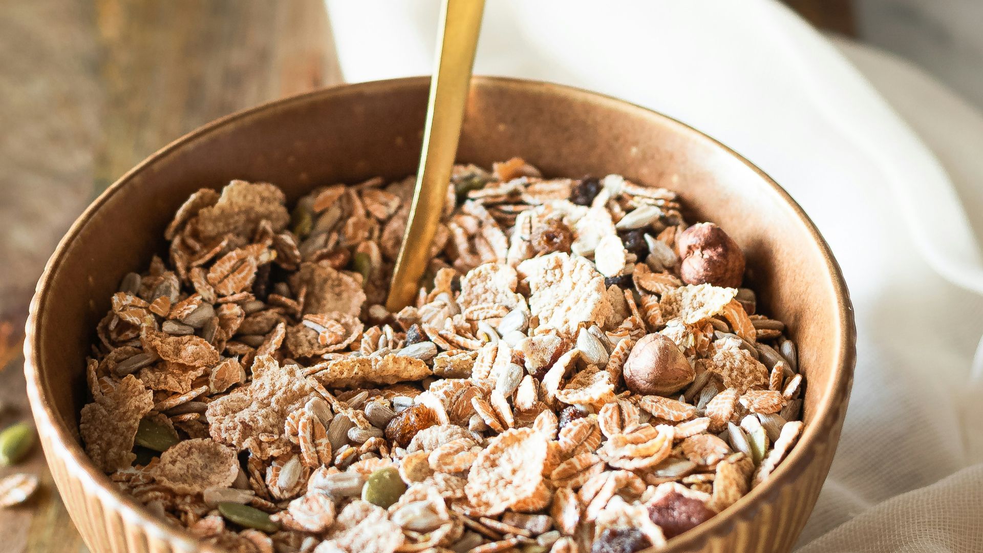 brown and white ice cream in brown ceramic bowl
