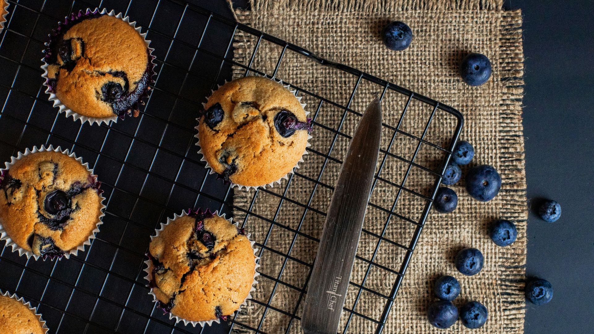 black handled knife on blue textile