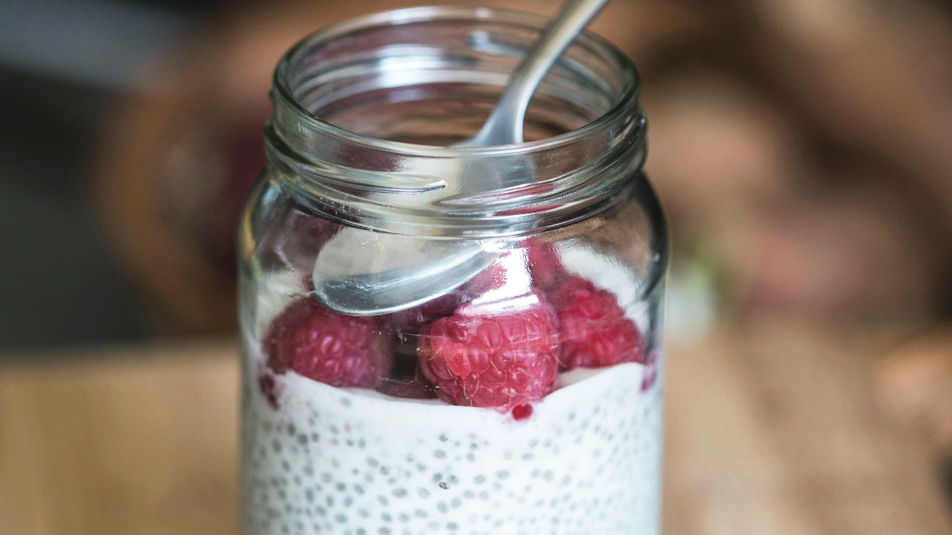 red cherries on clear glass bowl