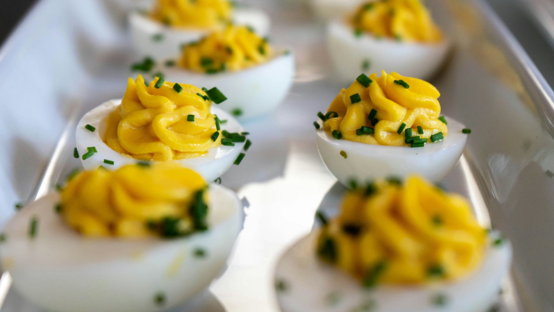 white and yellow icing covered cupcakes