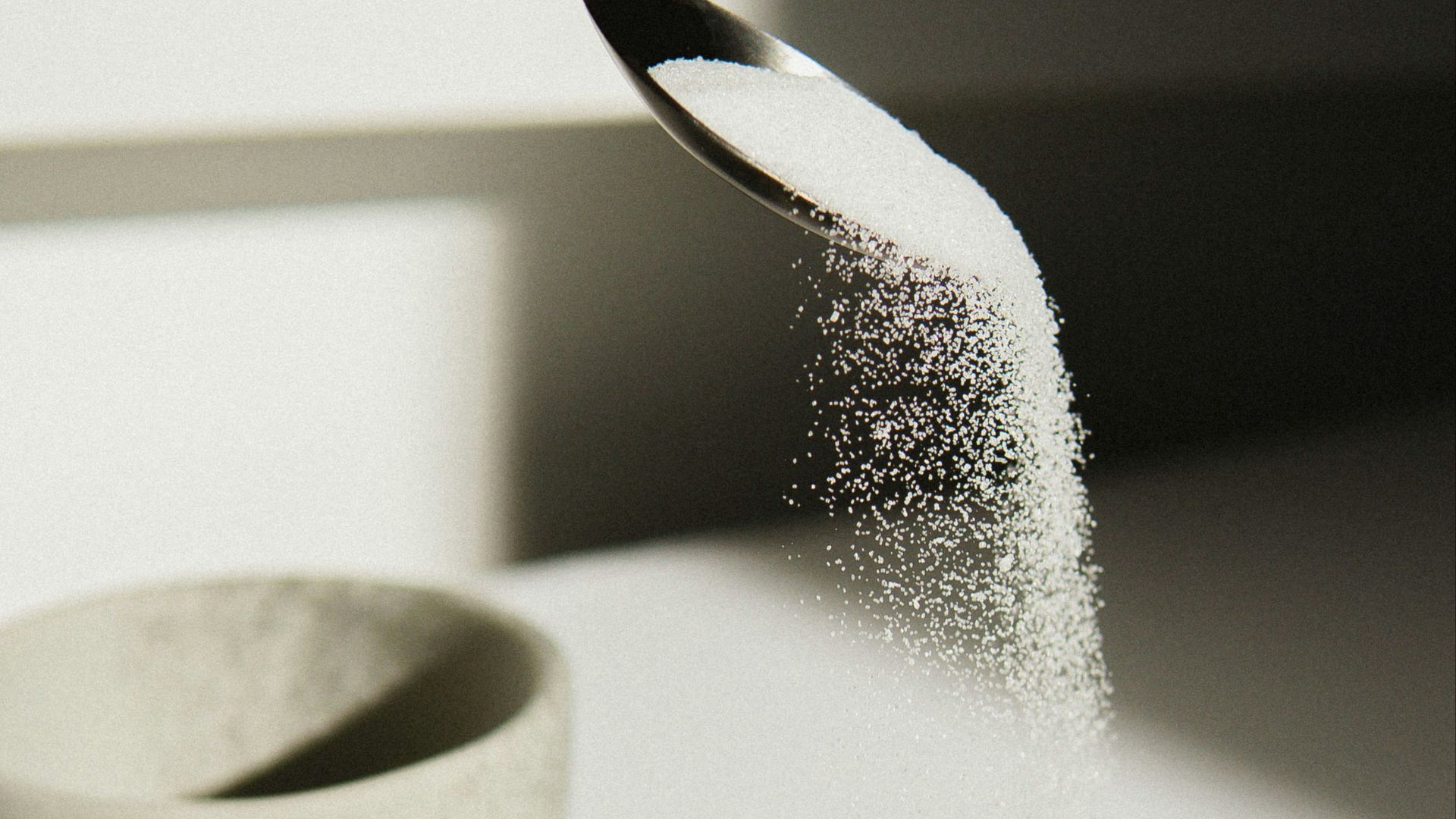 white ceramic bowl on white table