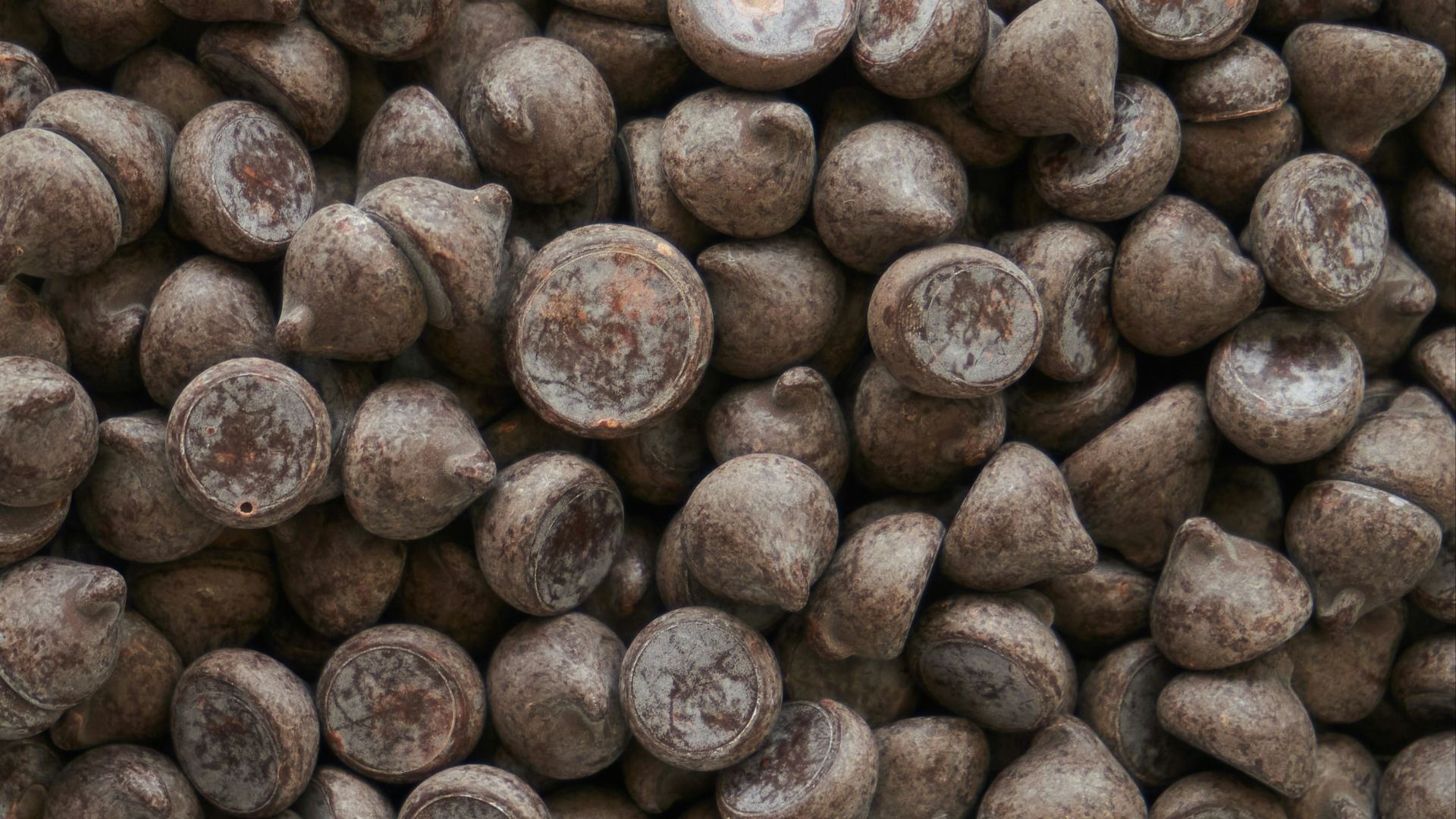 brown coffee beans on brown wooden surface