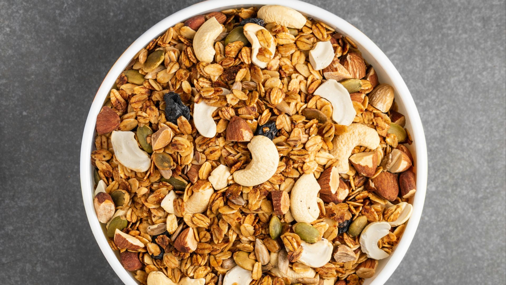 brown peanuts in white ceramic bowl