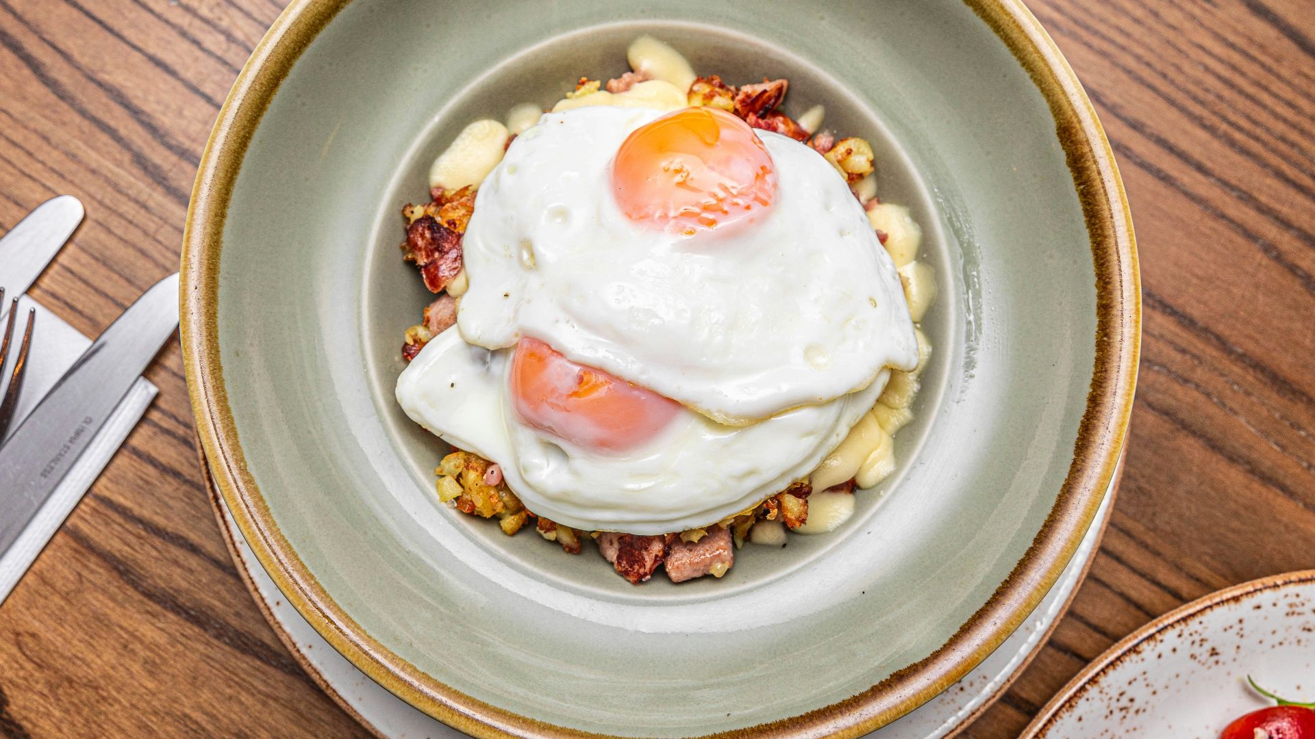a bowl of food on a wooden table