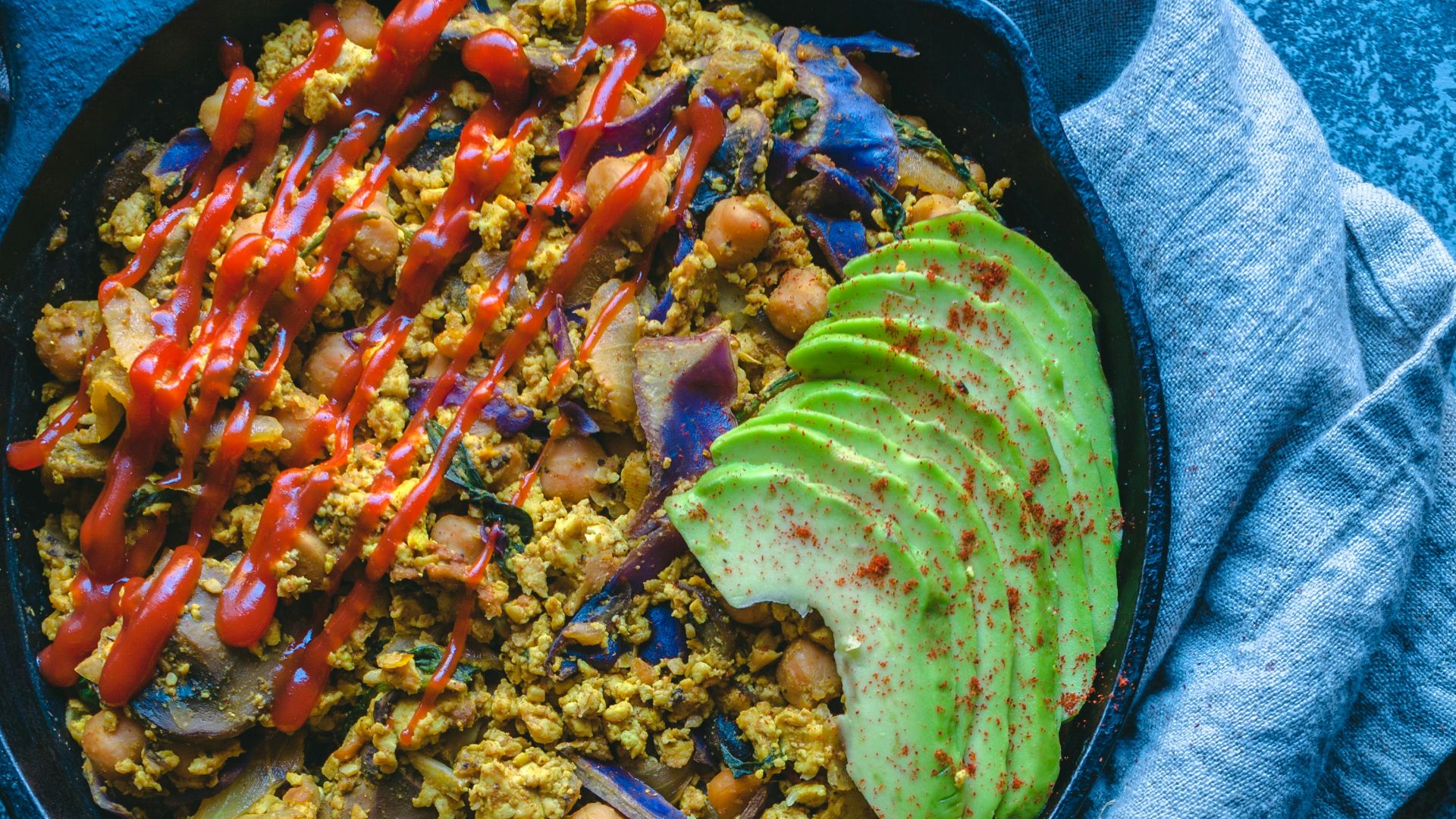a bowl of food on a table with a spoon