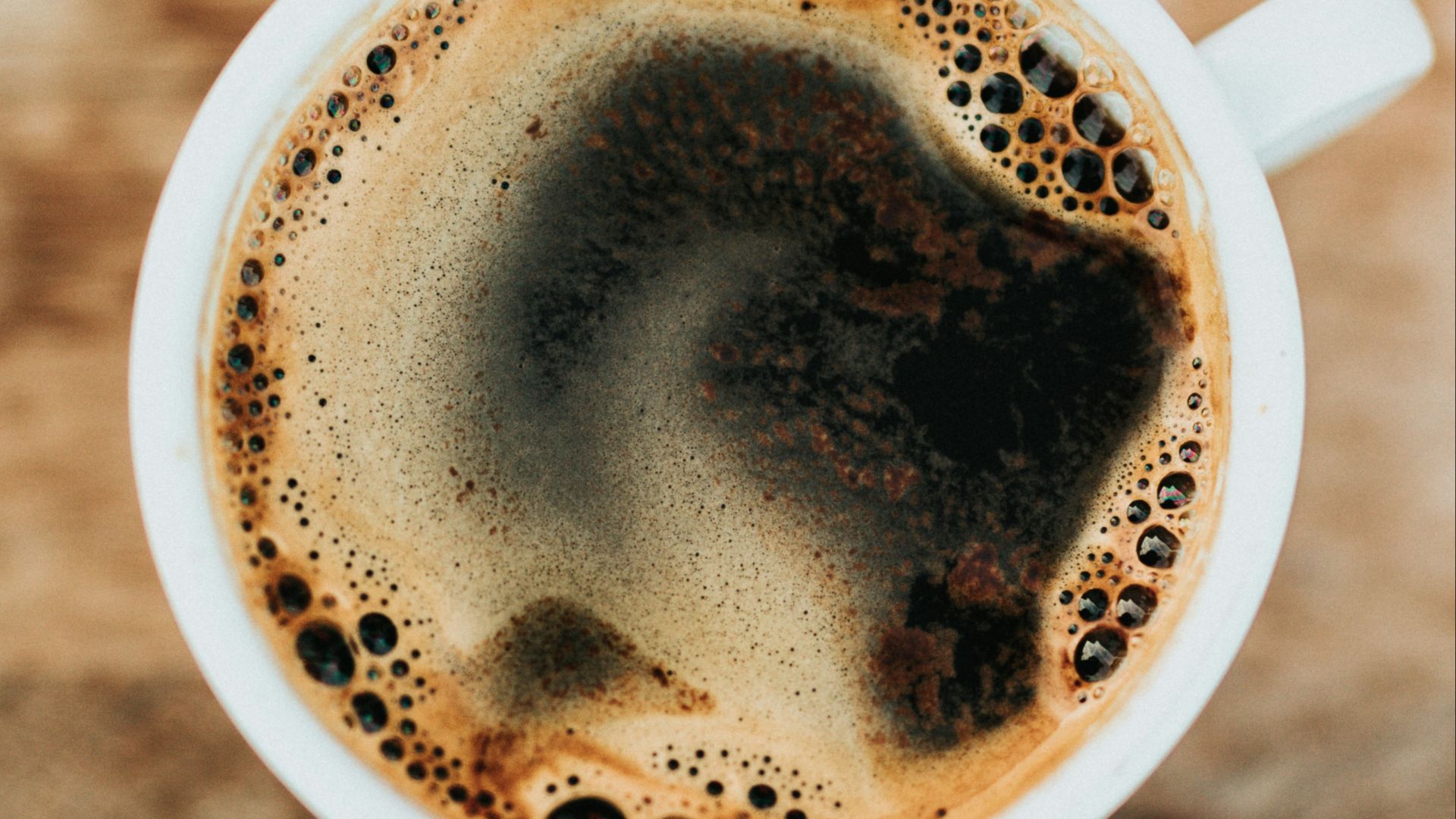white ceramic mug filled with coffee