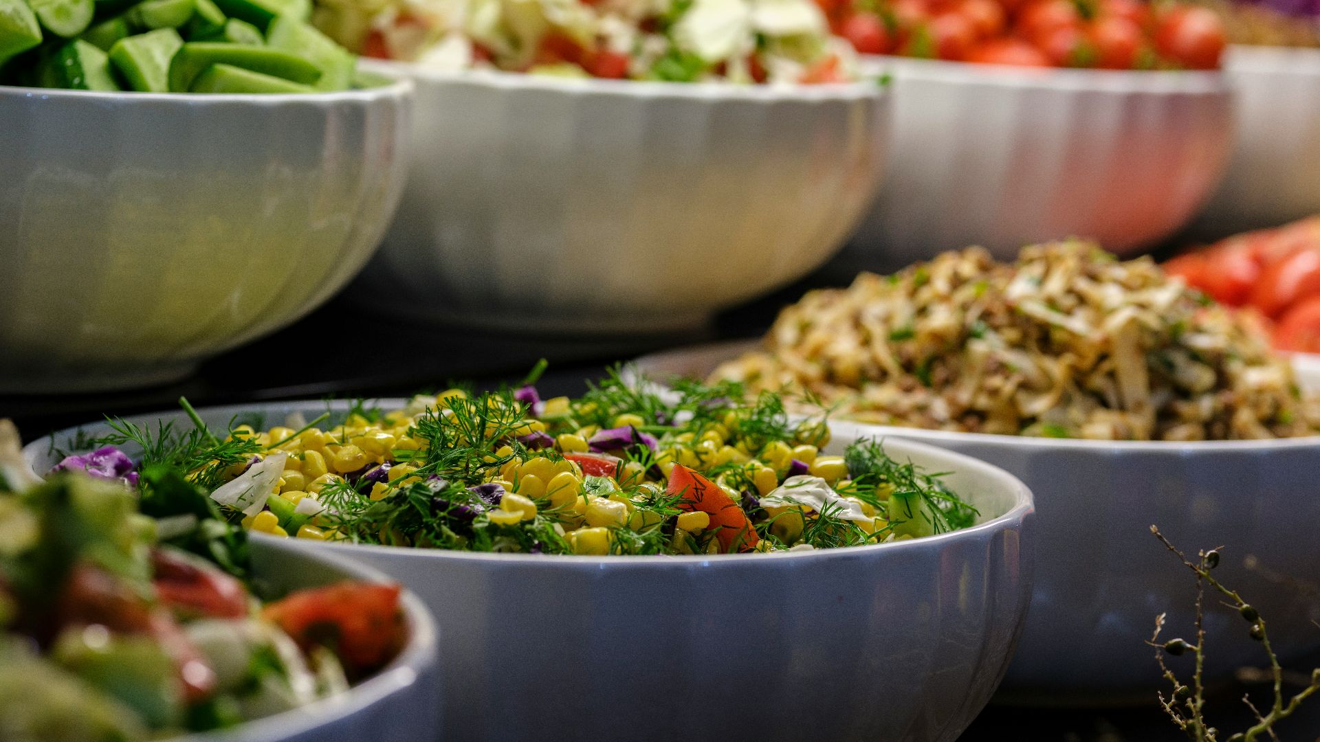 a group of bowls full of food