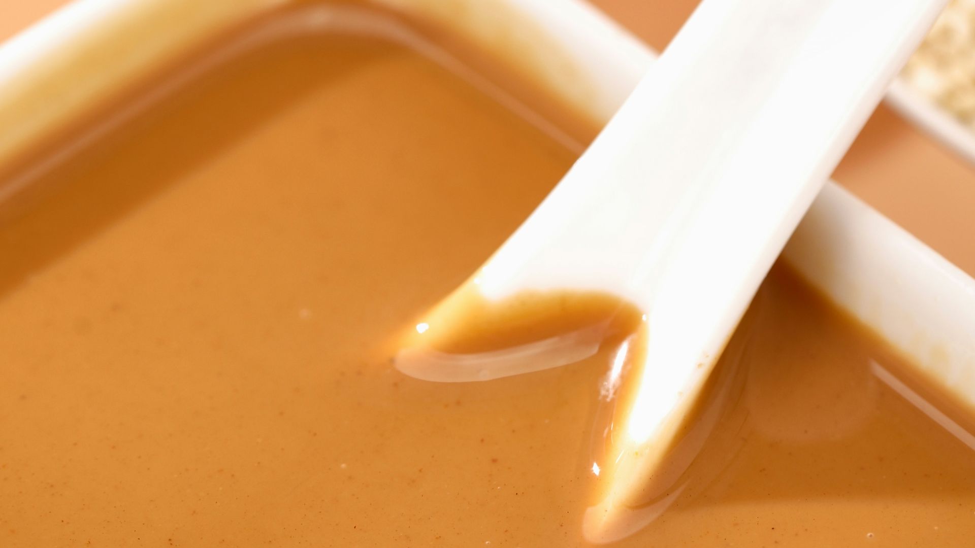 a bowl of soup with a spoon sticking out of it