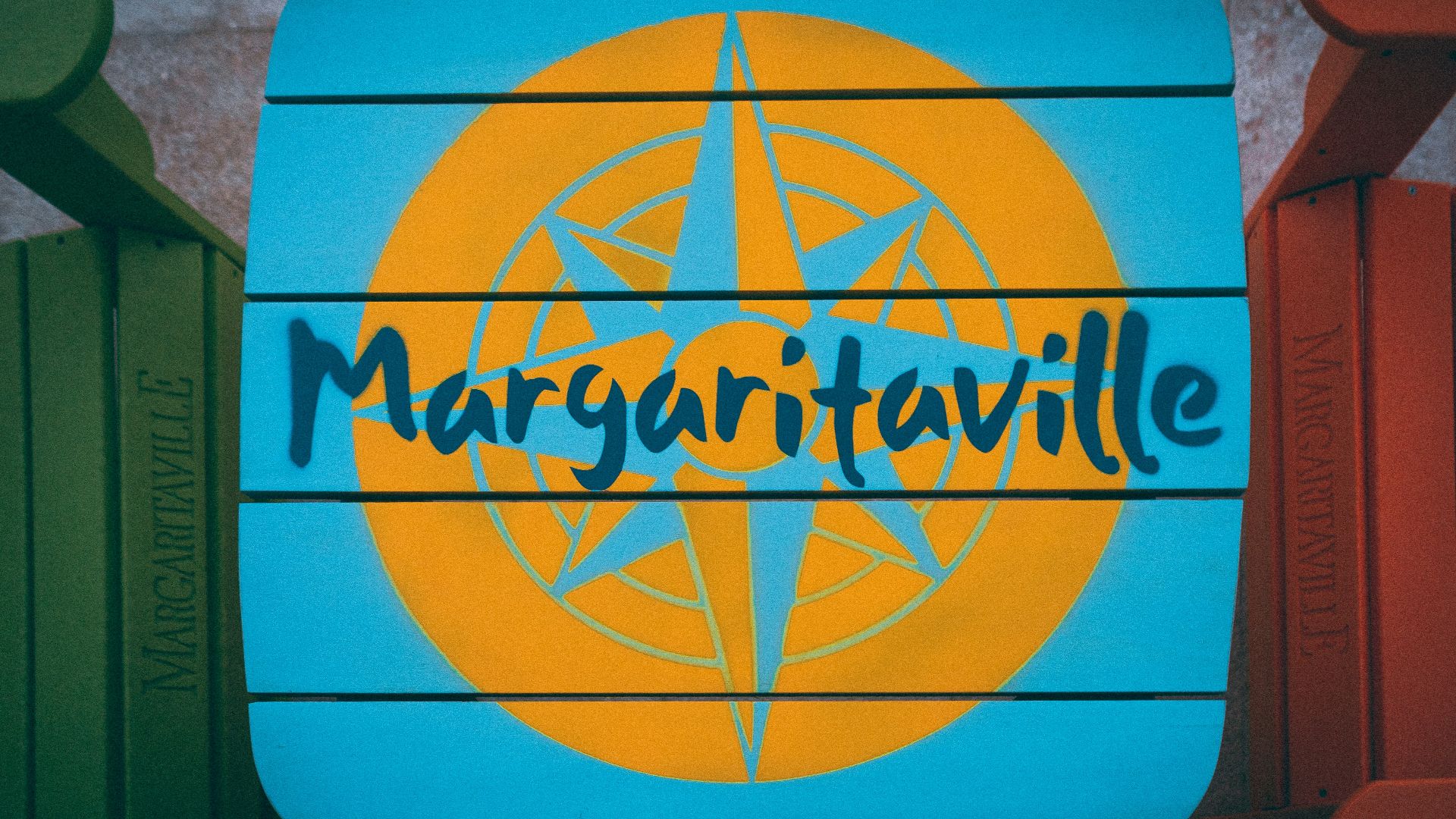 a blue and yellow sign that reads margaritaville