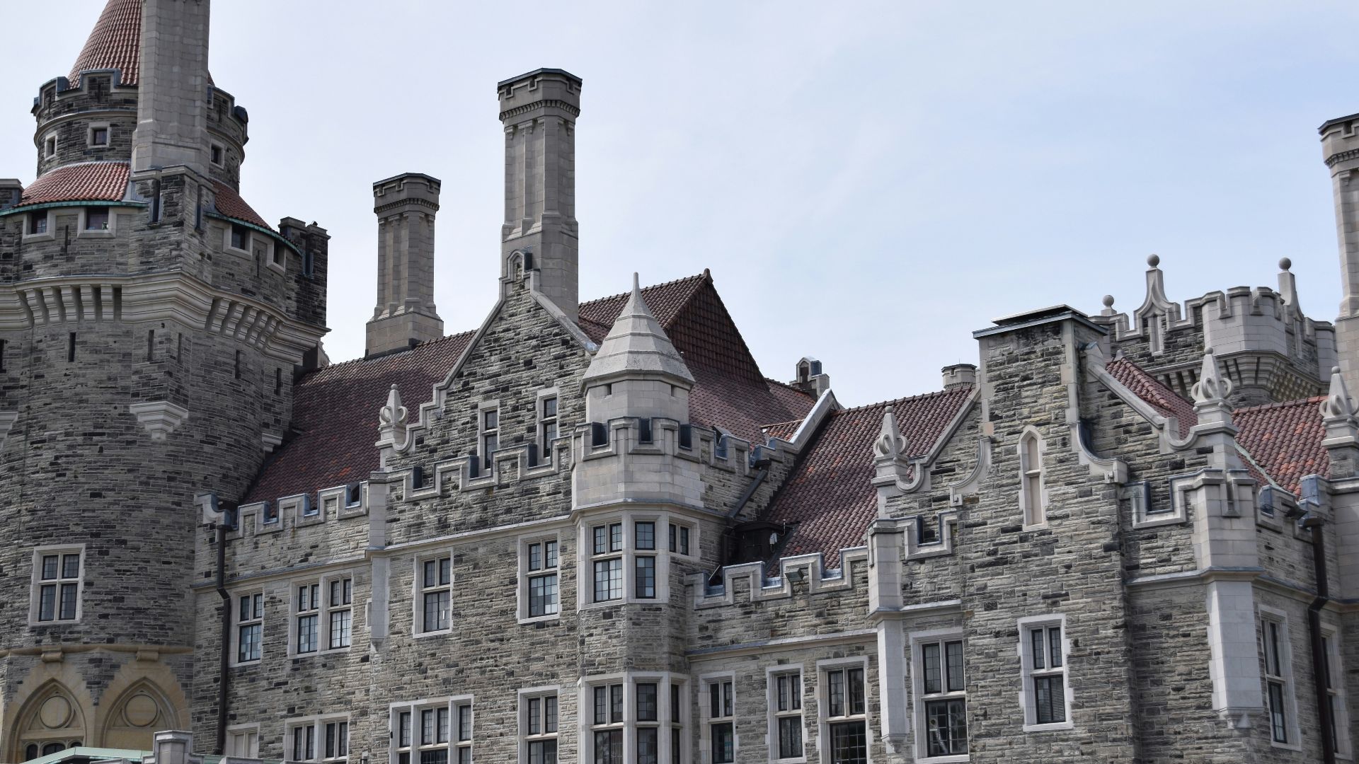 a large castle like building with a flag flying in front of it