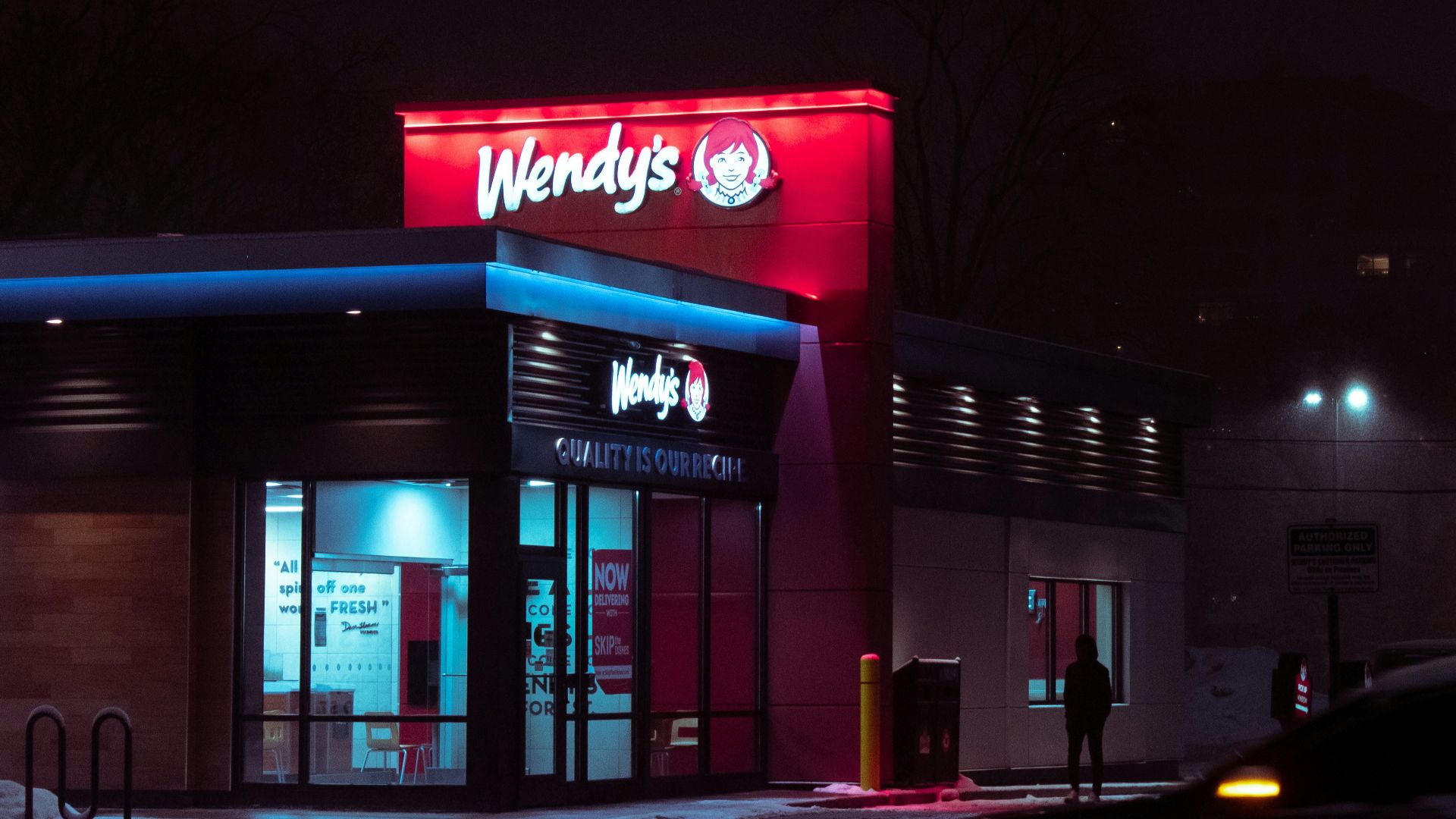 red and white concrete building during nighttime