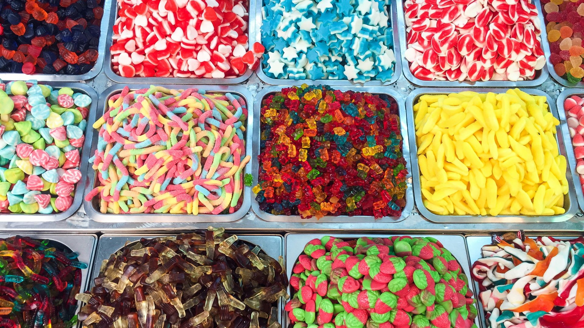 assorted candies in plastic containers