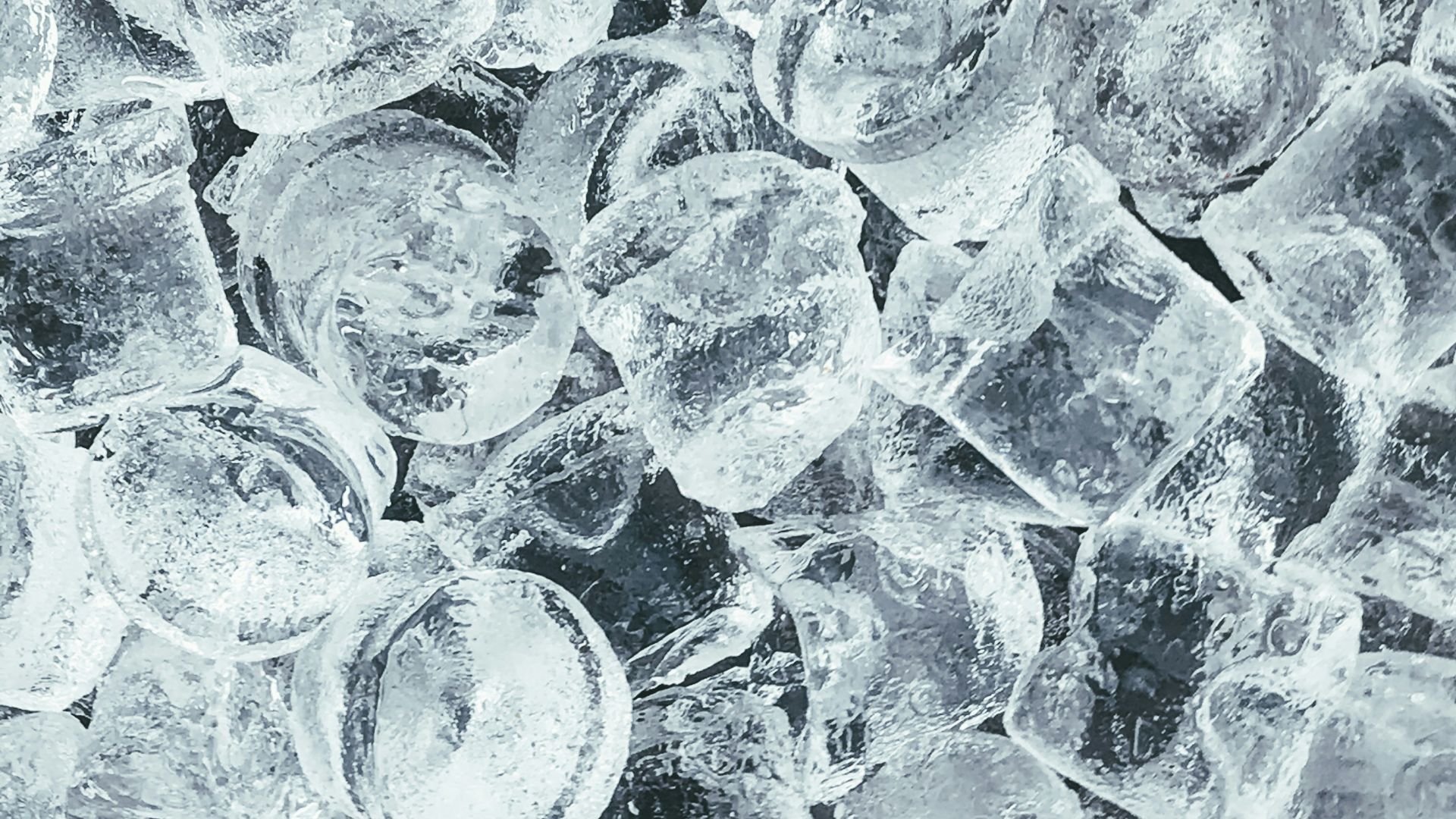 clear glass round ornament on gray stone