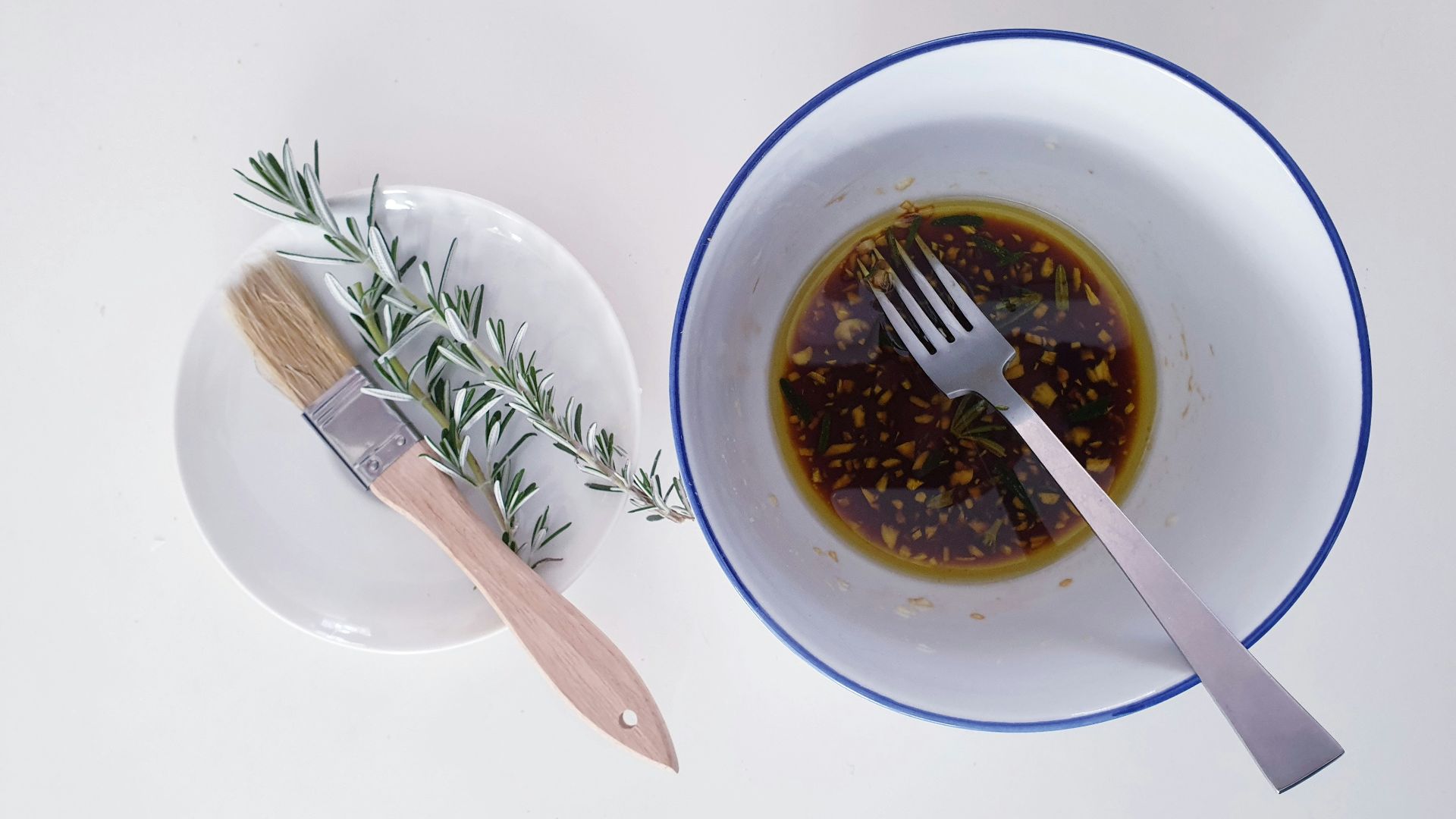 a bowl of olive oil and a fork
