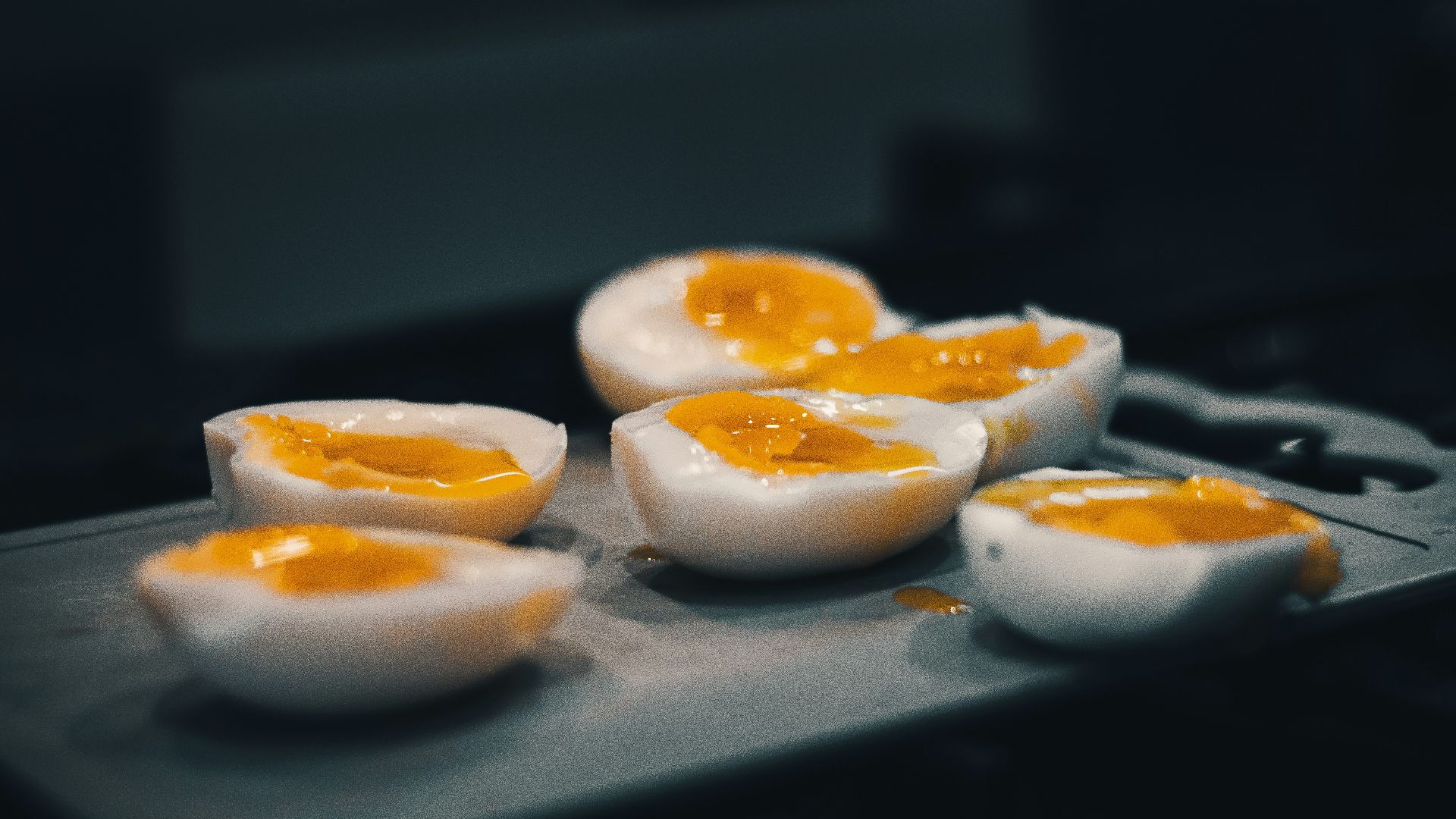 hard boiled eggs are sitting on a tray