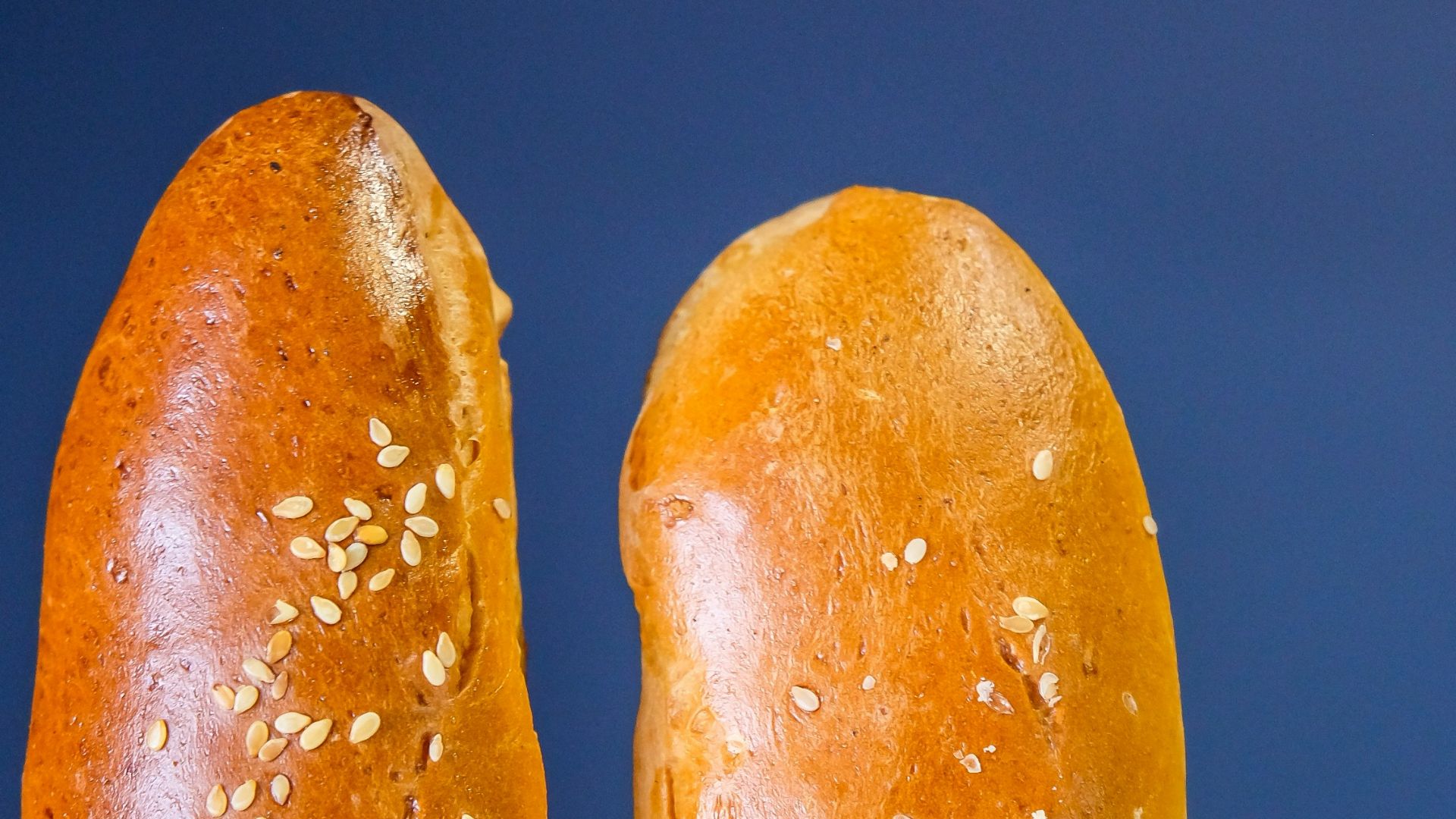 two brown bread on white paper