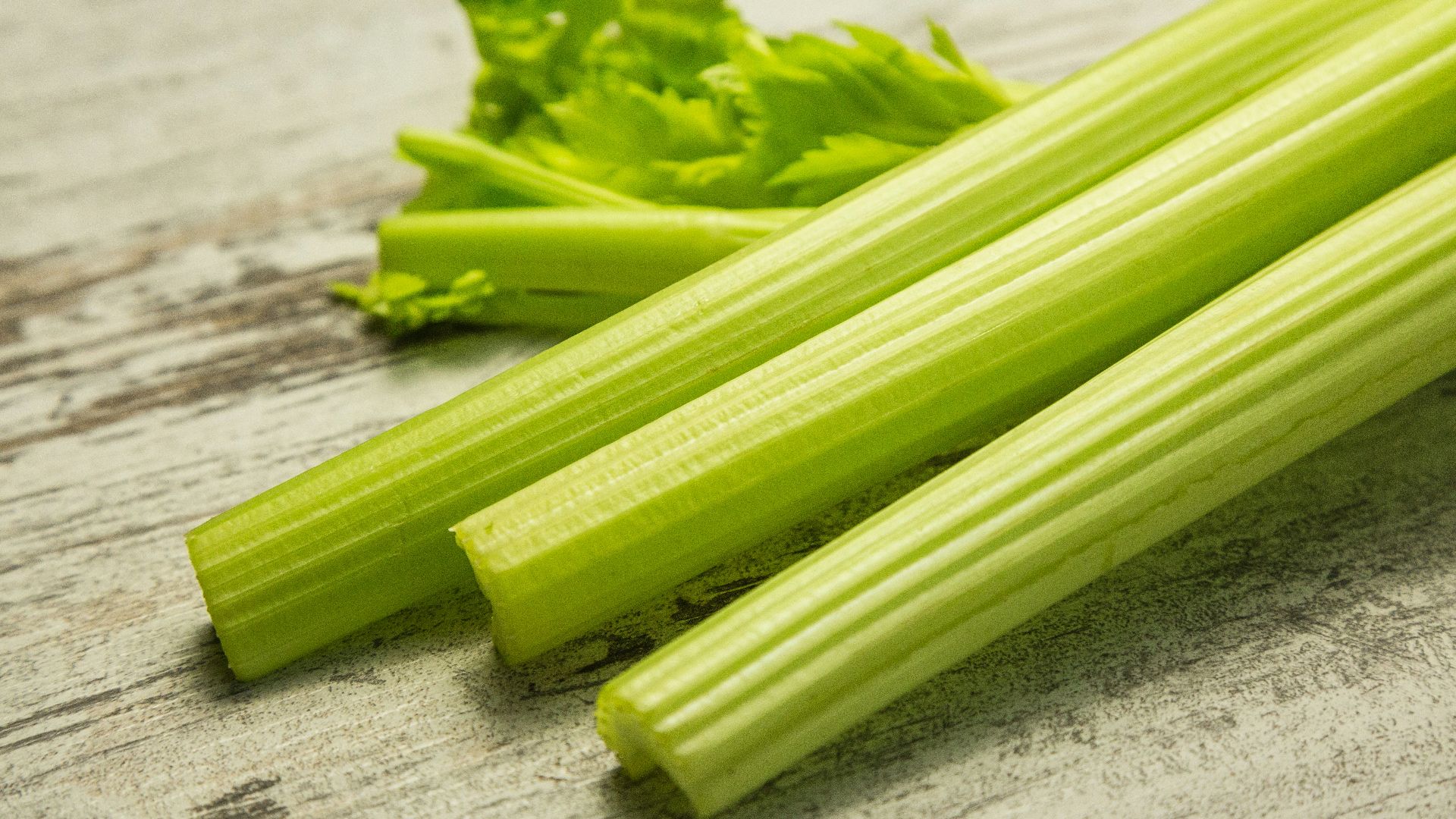 green vegetable on gray wooden table